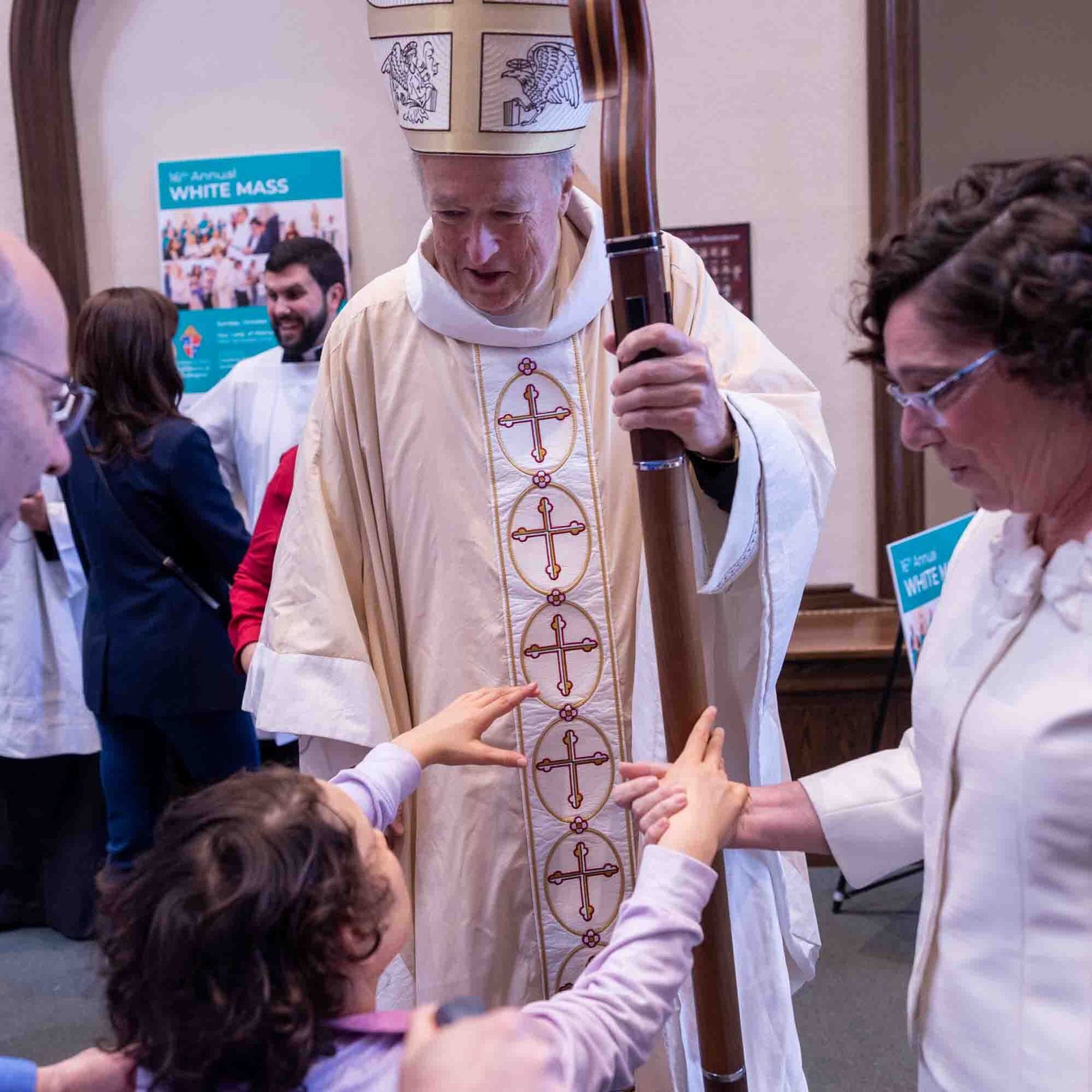 Cardinal Robert W. McElroy greets Teresa Hall after the Archdiocese of Washington’s annual White Mass at Our Lady of Mercy Church in Potomac on Oct. 26. Standing beside them are her father, Felipe Hall, and Mary O’Meara, executive director of the archdiocesan Office of Deaf and Disability Ministries. (Catholic Standard photo by Mihoko Owada.)