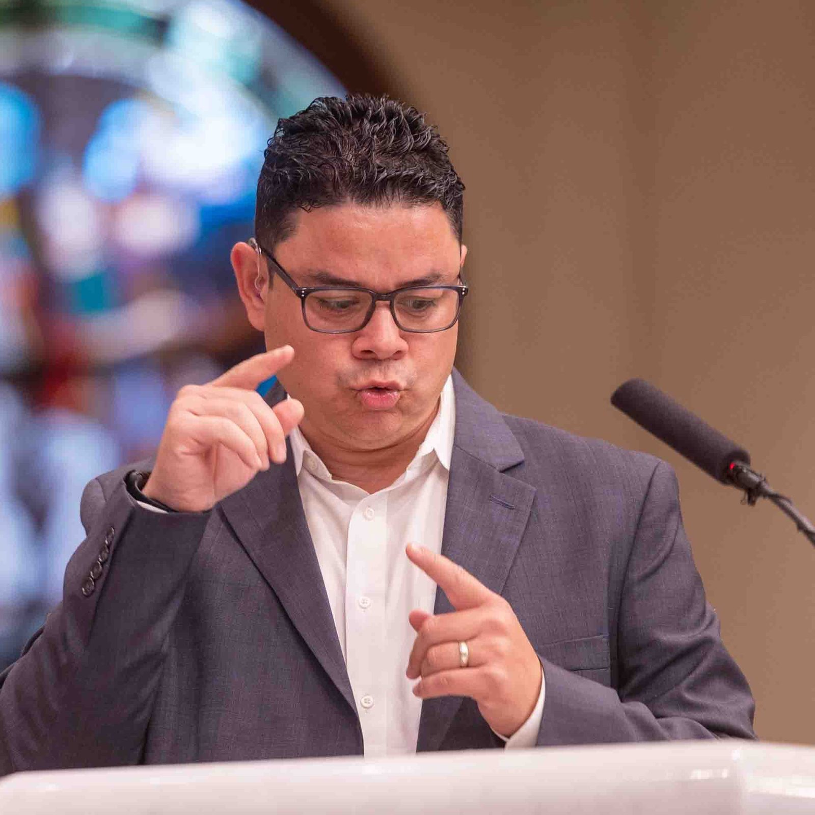 Brian Pazmino uses American Sign Language while serving as a lector during the White Mass on Oct. 26 at Our Lady of Mercy Church in Potomac. He is a member of St. Raphael Parish in Rockville. (Catholic Standard photo by Mihoko Owada)