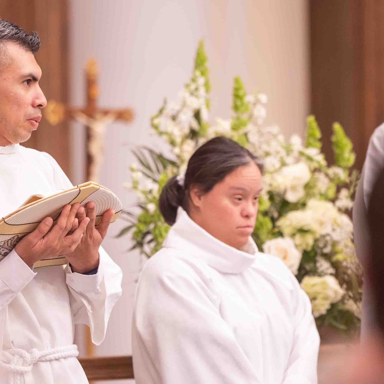 Wille Caro ( at left) and Maria Guadalupe ( at right) serve during the White Mass on Oct. 26 at Our Lady of Mercy Church in Potomac. (Catholic Standard Photo by Mihoko Owada)