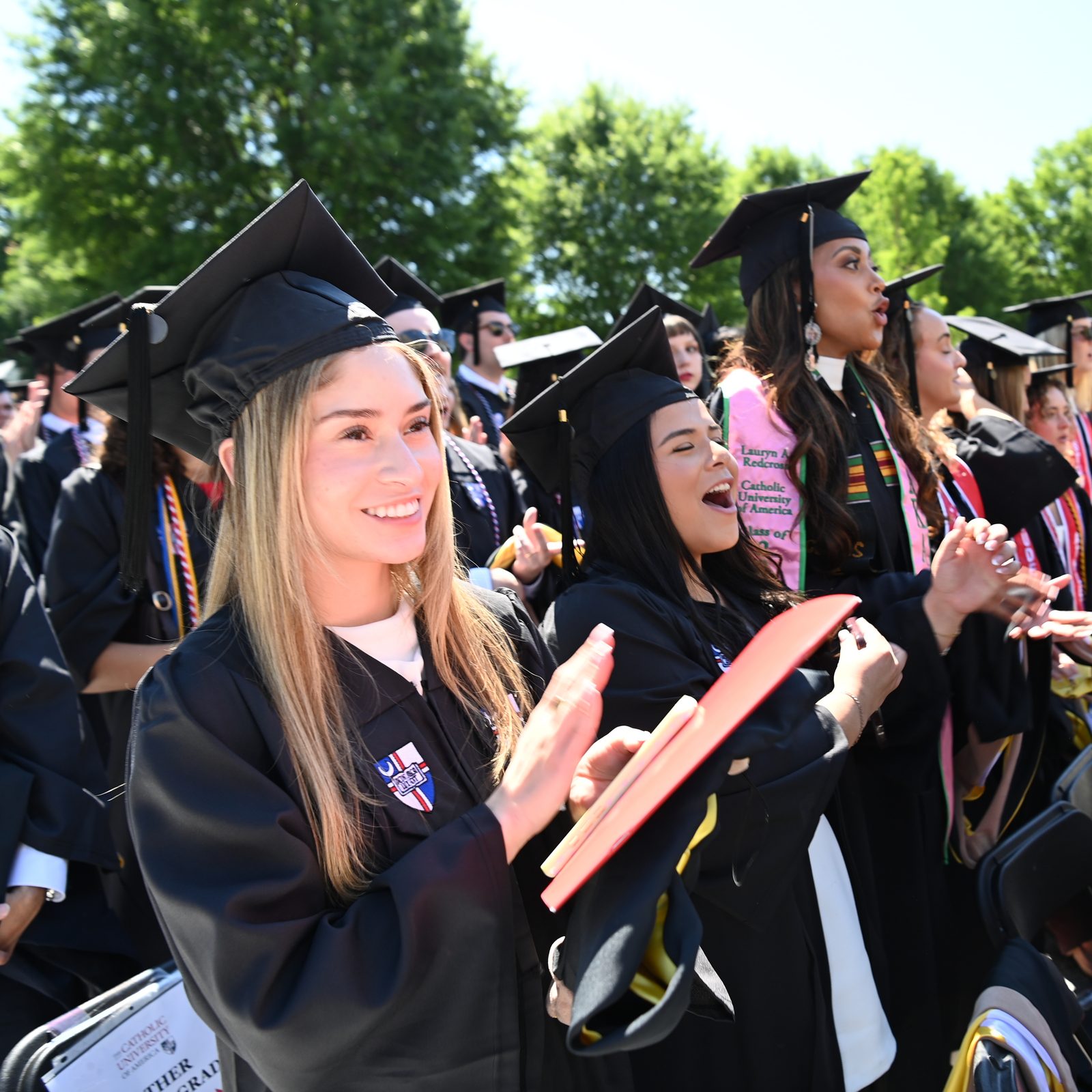 Graduates cheer during their graduation ceremony at The Catholic University of America. Commencement was held on the university’s Washington, D.C., campus on May 16. More than 1,500 students graduated from the University this year. (Photo by Patrick G. Ryan/The Catholic University of America)