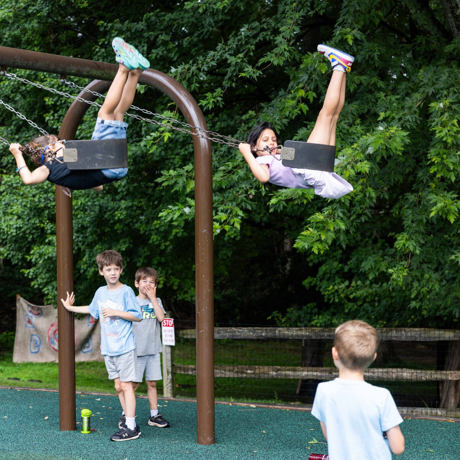 Campers swing and play in the playground during the Rockville Catholic Summer Program on Aug. 5 at St. Patrick’s Parish. (Catholic Standard photo by Andrew Biraj)