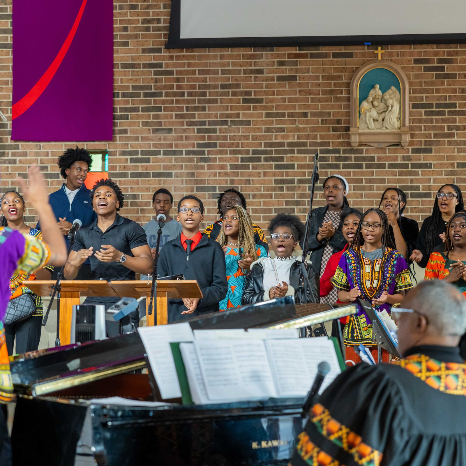 Members of the St. Joseph Community of Africans and Friends Traditional African Choir sing during the Mass to Commemorate Black History Month on Feb. 21, 2026 at St. Joseph Catholic Church in Largo, Maryland. (Catholic Standard photos by Andrew Biraj)