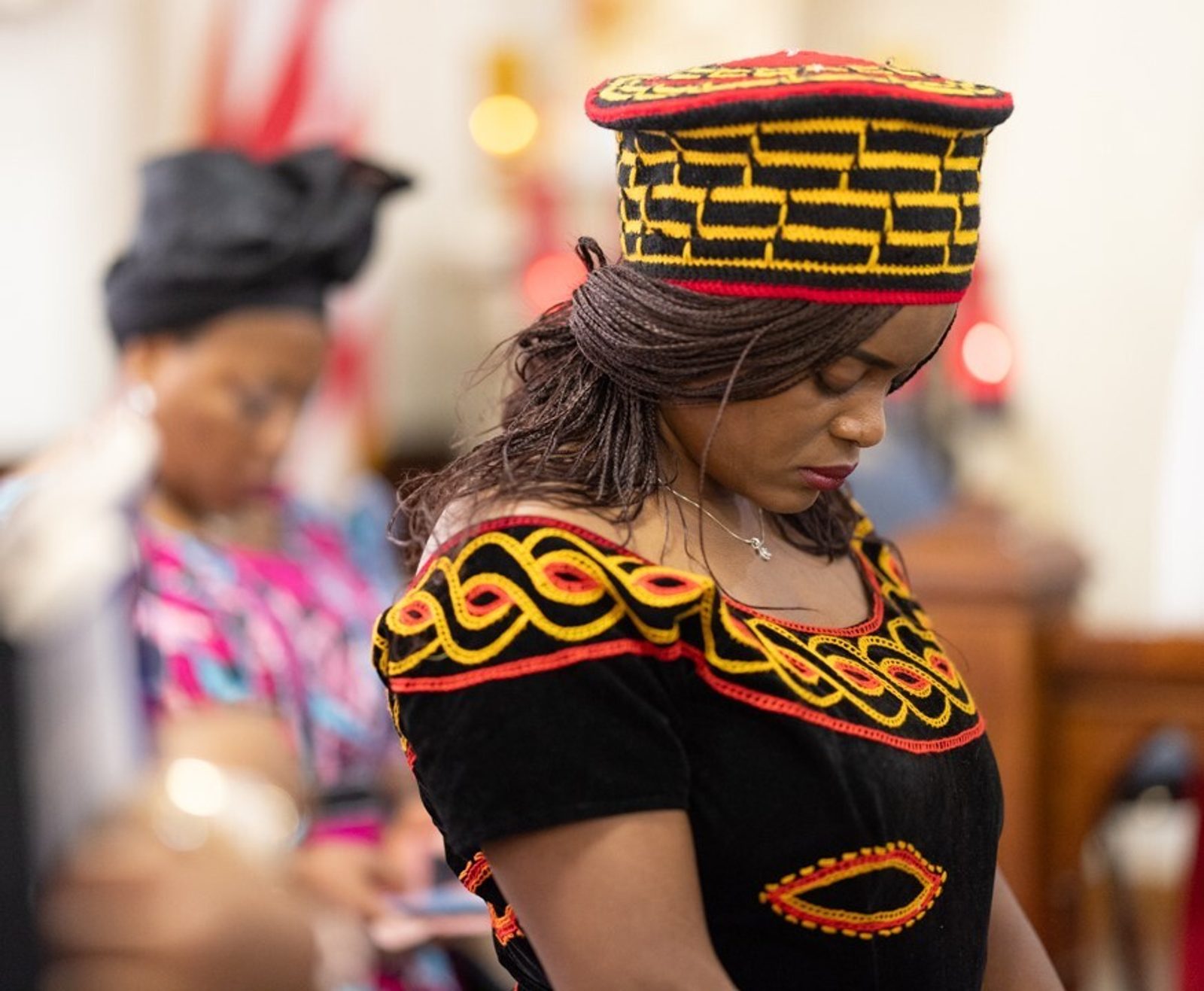 A woman in the African Praise Choir prays during a Mass marking the 200th anniversary of St. Mary of the Assumption Parish in Upper Marlboro, Maryland, on June 2, 2024. (Catholic Standard photo by Andrew Biraj)