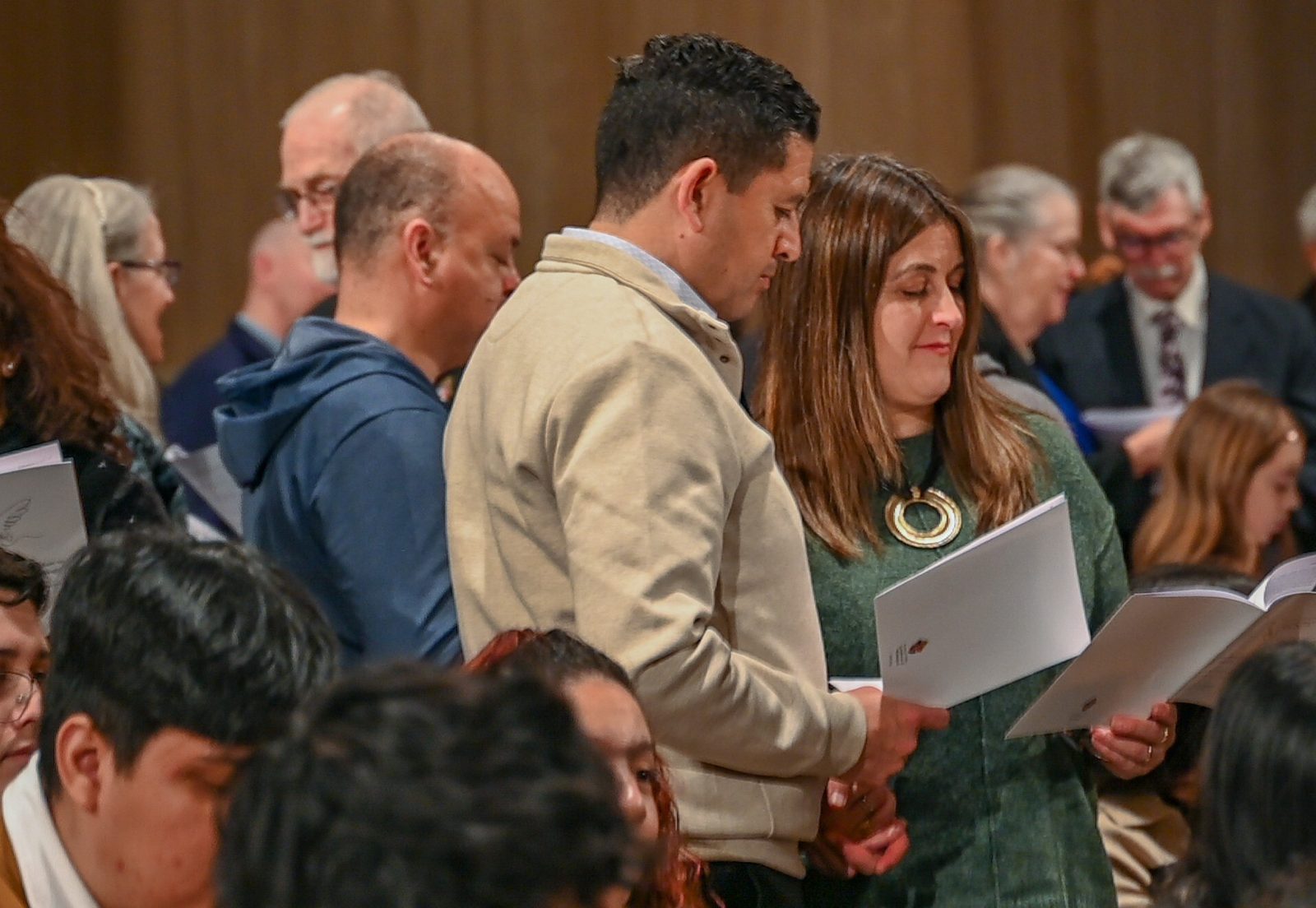 Couples hold hands and renew their vows during the Annual Wedding Mass to celebrate the vocation of marriage on Feb. 8, 2025, at the Basilica of the National Shrine of the Immaculate Conception. The Mass was sponsored by the Office of Family Life of The Roman Catholic Archdiocese of Washington. Washington Auxiliary Bishop Evelio Menjívar, the celebrant of the Mass, encouraged couples to embrace their journey together, trusting in God’s grace to guide them. (Catholic Standard photo by Nicole Olea)