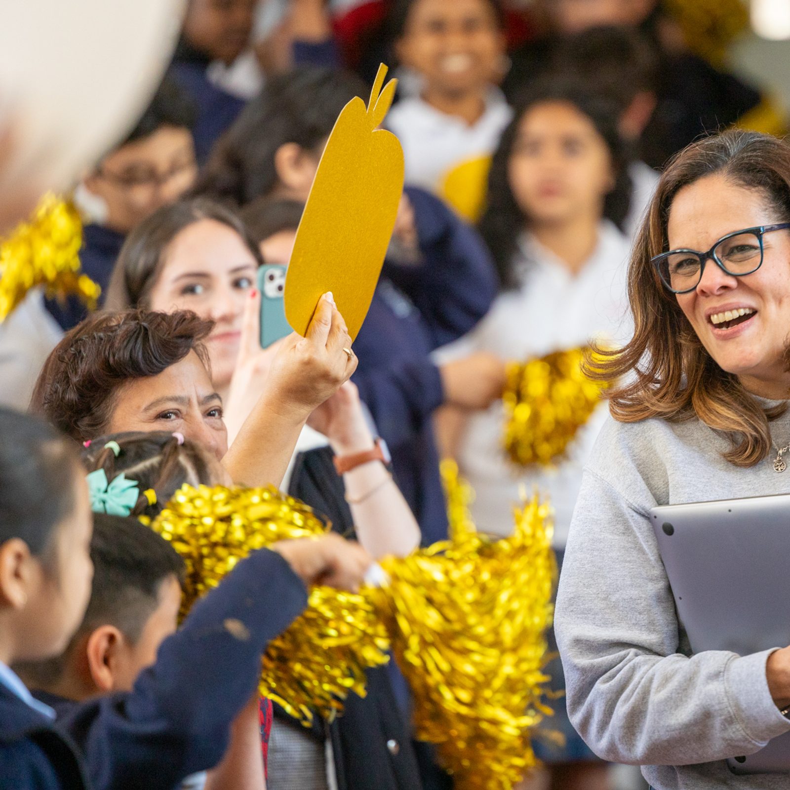 Patricia Gonzalez, who teaches pre-kindergarten to 3-year-olds at Sacred Heart School in Washington, D.C., arrives for a surprise school assembly on April 22, where it was announced that she is a 2024 Golden Apple Award-winning teacher. (Catholic Standard photo by Mihoko Owada)