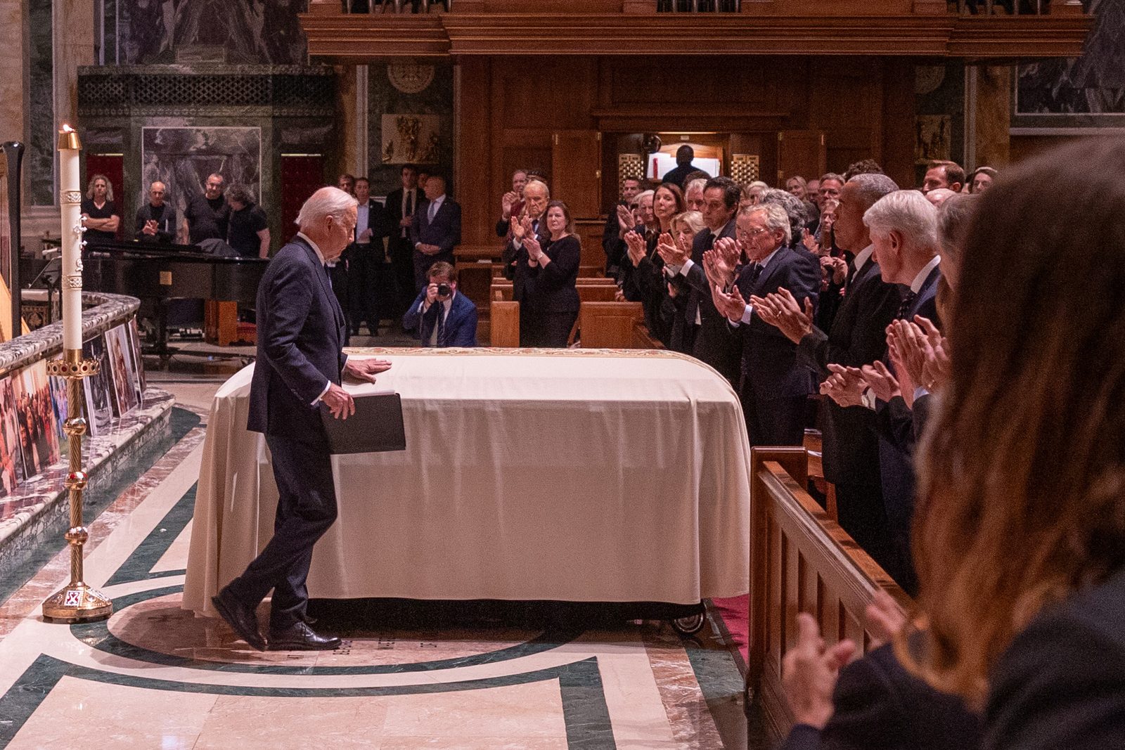 President Joe Biden touches the casket of the late Ethel Kennedy after offering remarks at an Oct. 16 celebration of her life held at the Cathedral of St. Matthew the Apostle in Washington, D.C. (Catholic Standard photo by Mihoko Owada)