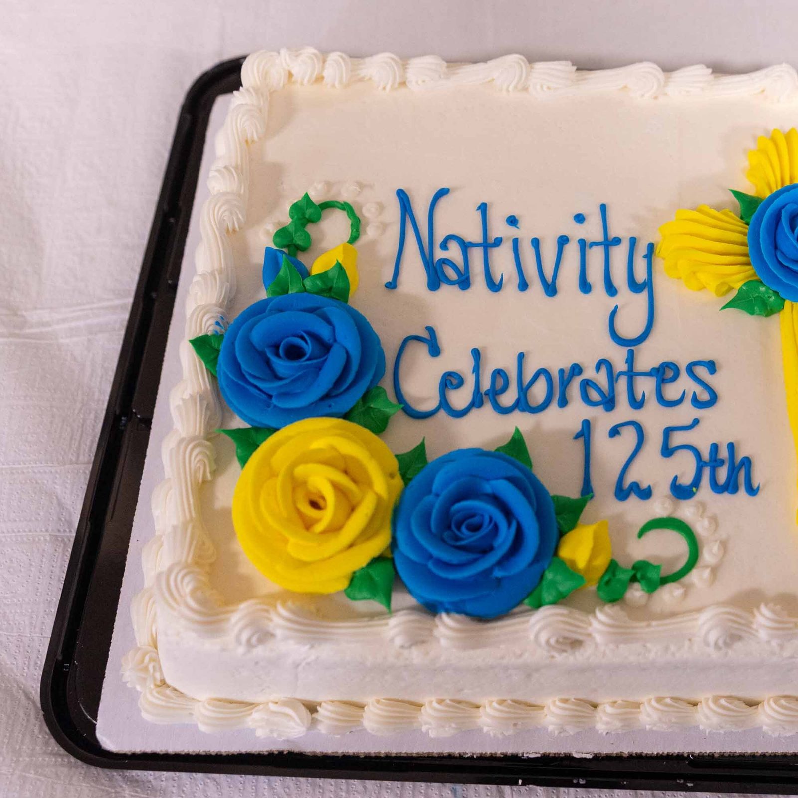 The reception following the 125th anniversary Mass for Nativity Parish in Washington, D.C., on Feb. 22, 2026 included a special cake for the celebration. (Catholic Standard photo by Mihoko Owada)