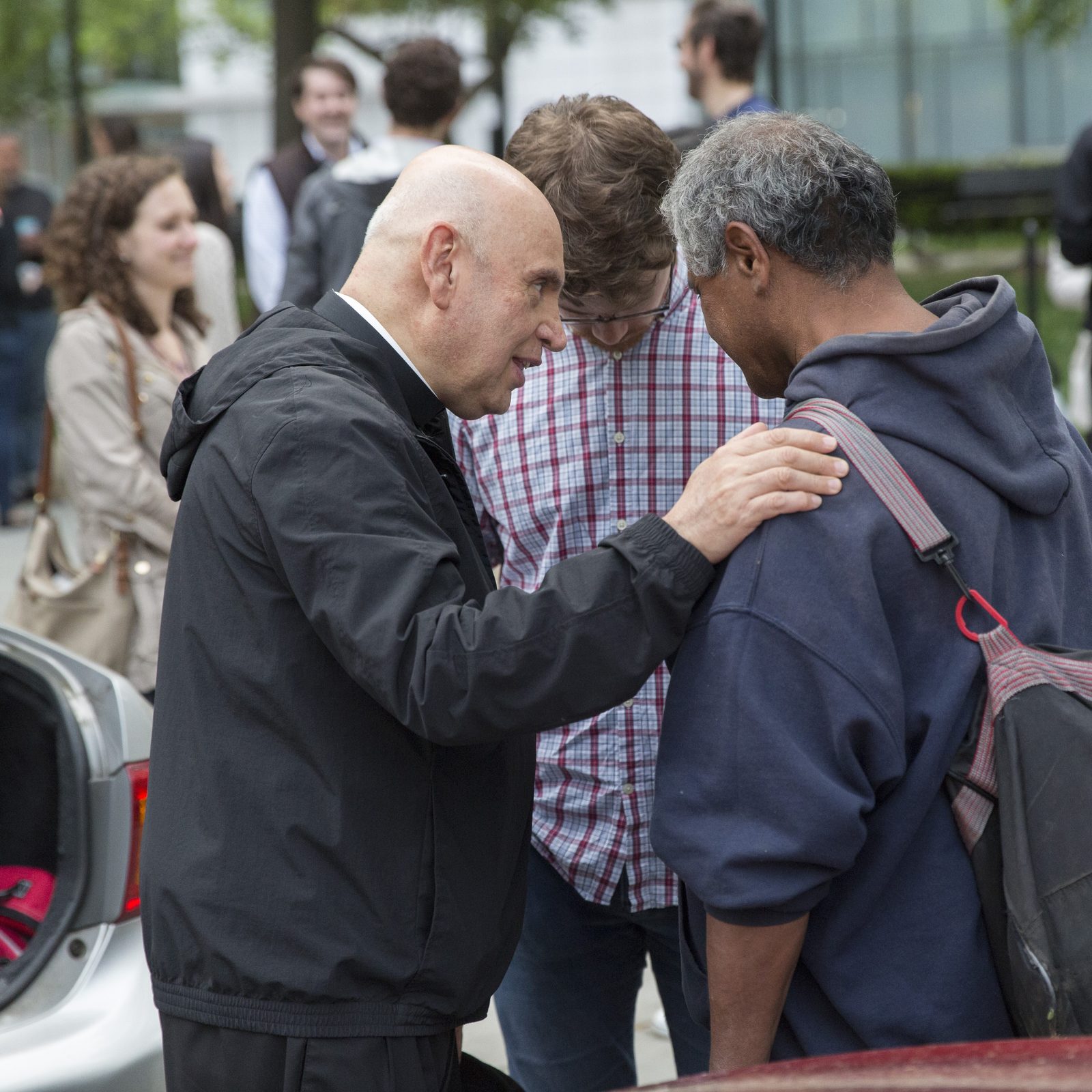 In a photo from May 2018, then-Washington Auxiliary Bishop Mario Dorsonville and young adult volunteer Patrick McGervey pray with a man they met on the streets of Washington during a homeless mission. In 2023, Bishop Dorsonville became the bishop of Houma-Thibodaux, Louisiana, and he died in January 2024. The Mario E. Dorsonville Foundation and its homeless mission continue the bishop’s legacy of caring for the poor. (Catholic Standard photo by Jaclyn Lippelmann)