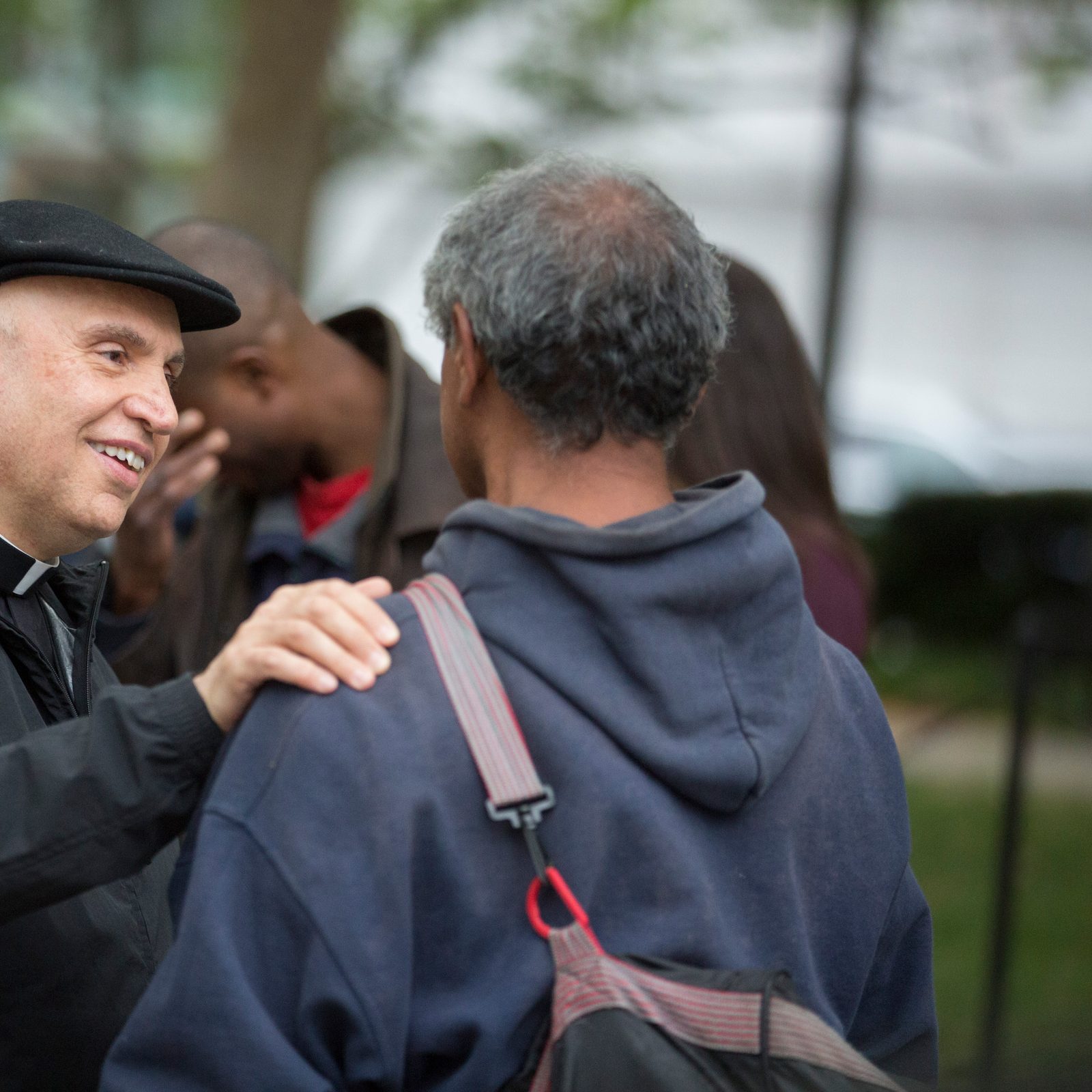 In photo from May 2018, then-Washington Auxiliary Bishop Mario Dorsonville smiles as he talks with a man he met on the streets of Washington during a homeless mission that he started with young adult Catholics. In 2023, Bishop Dorsonville became the bishop of Houma-Thibodaux, Louisiana, and he died in January 2024. The Mario E. Dorsonville Foundation and its homeless mission continue the bishop’s legacy of serving the poor in the nation’s capital and offering friendship to them. (Catholic Standard photo by Jaclyn Lippelmann)