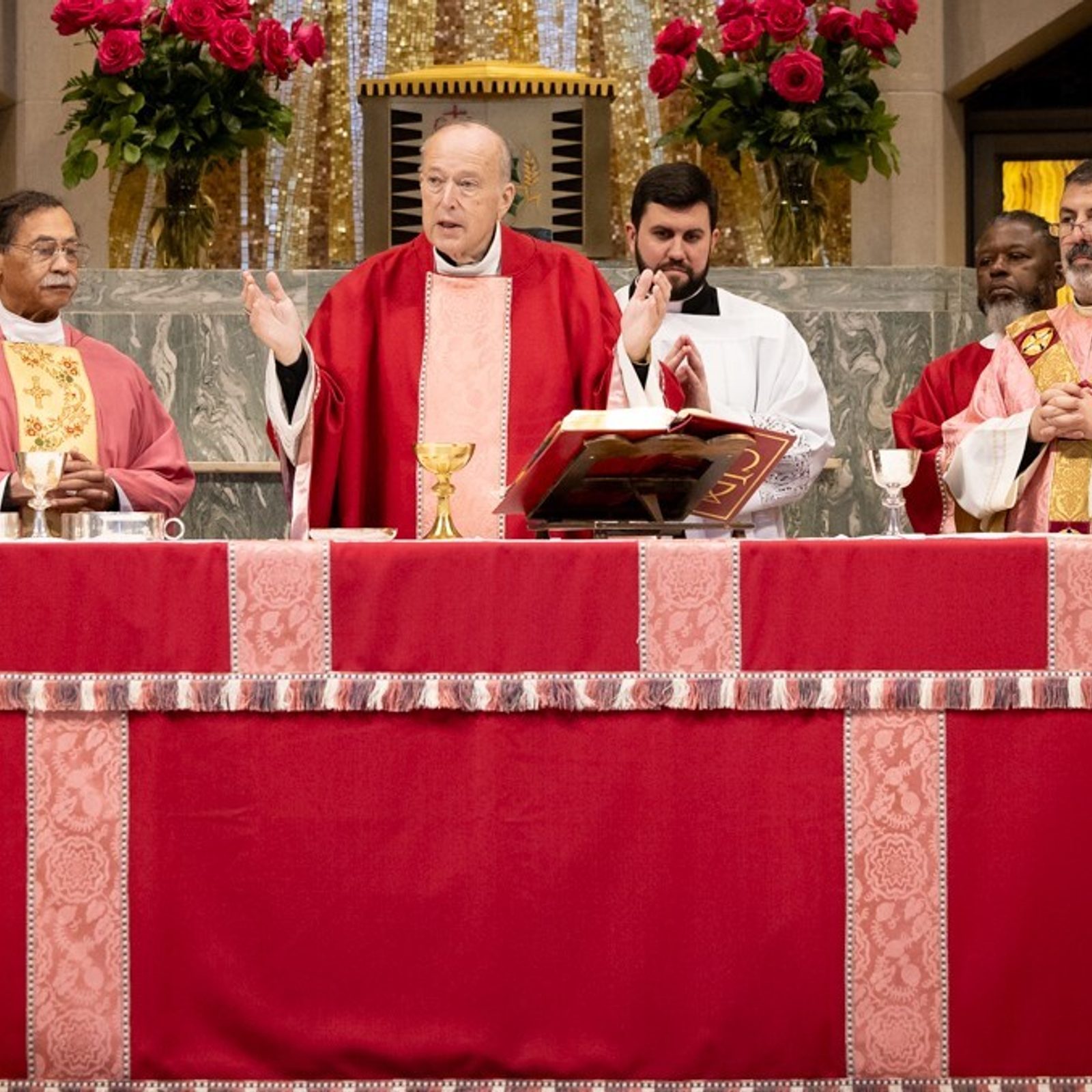 Washington Cardinal Robert W. McElroy celebrates the annual Rose Mass for health care workers on March 15, 2026 at the Church of the Little Flower in Bethesda. From left to right are Father Lee Fangmeyer, Little Flower’s pastor; Deacon Don Longano; Washington Auxiliary Bishop Roy Campbell Jr.; Cardinal McElroy; Father Thomas Robertson, the archbishop’s priest secretary; Deacon Darryl Kelley; Washington Auxiliary Bishop Juan Esposito; and Father Joseph Murphy. (Photo by Christopher Newkumet for the John Carroll Society)