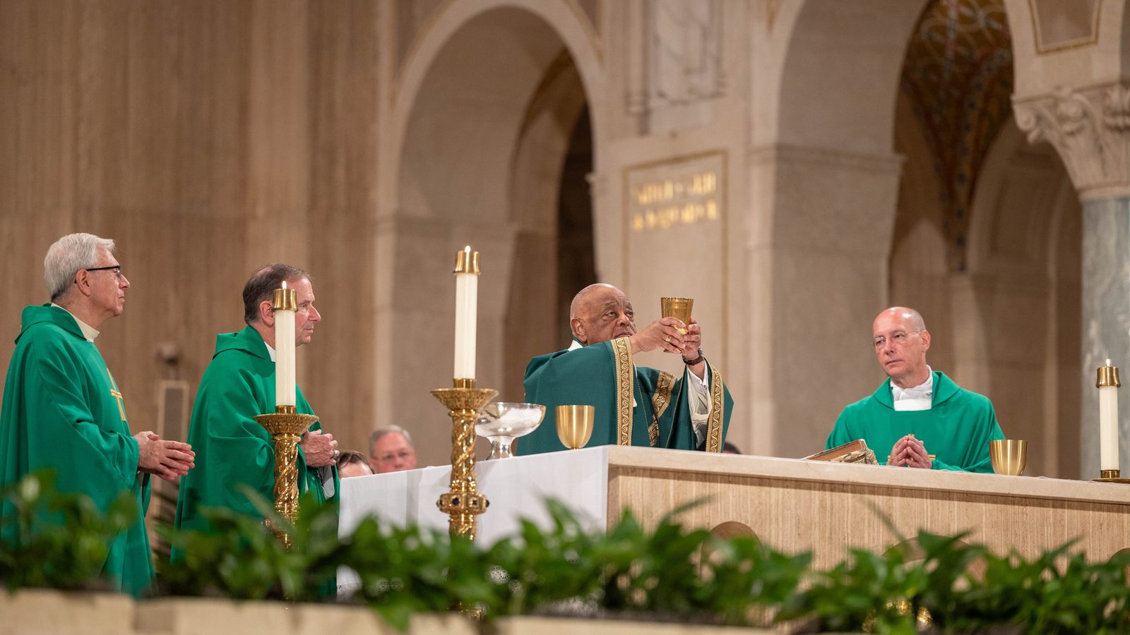 Washington Cardinal Wilton Gregory at center celebrates the National Eucharistic Pilgrimage Mass on June 9, 2024 at the Basilica of the National Shrine of the Immaculate Conception. The concelebrants at the Mass included, at left, Msgr. Vito A. Buonanno, the director of pilgrimages at the basilica, and Arlington Bishop Michael F. Burbidge; and at right, Msgr. Walter R. Rossi, the basilica’s rector. The Mass marked the closing event of the National Eucharistic Pilgrimage stop in the nation’s capital. (Catholic Standard photo by Mihoko Owada)