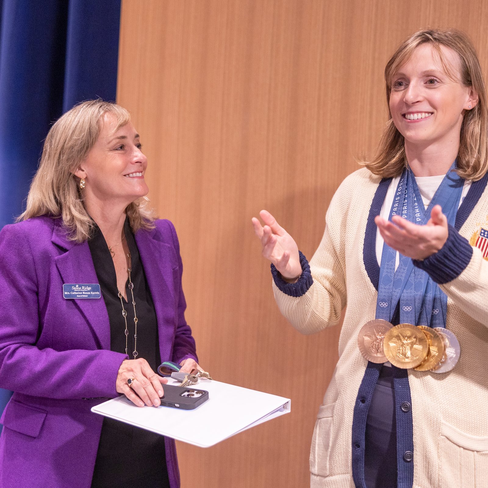 During a visit to her alma mater, Stone Ridge School of the Sacred Heart in Bethesda, Maryland, on Oct. 22, 2024, Olympic champion swimmer Katie Ledecky stands with Catherine Ronan Karrels, the Head of School at Stone Ridge. Ledecky is a 2015 graduate of Stone Ridge, and Karrels is a 1986 graduate of the school. Ledecky returned to Stone Ridge to visit with students and tell them about her experiences at the 2024 Summer Olympic Games in Paris, where she won two gold medals, a silver medal and a bronze medal. (Catholic Standard photo by Mihoko Owada)