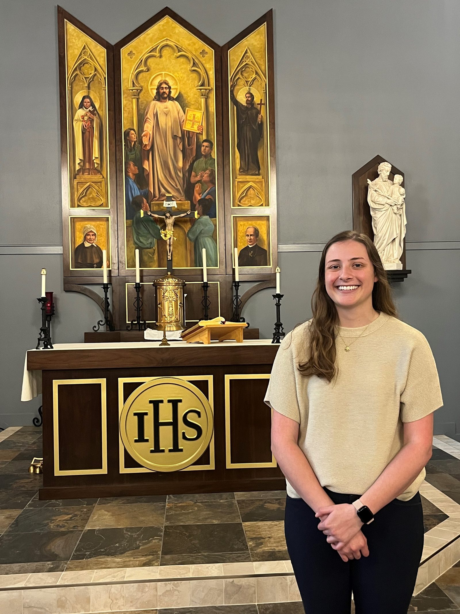 In a photo taken earlier this spring, Holly Kaufmann, a religion teacher at St. Mary’s Ryken High School in Leonardtown, Maryland, who is a 2024 Golden Apple Award-winning teacher in The Roman Catholic Archdiocese of Washington, stands in the school’s chapel, where she sometimes holds her classes. The chapel was instrumental in her conversion to Catholicism. (Catholic Standard photo by Mark Zimmermann)