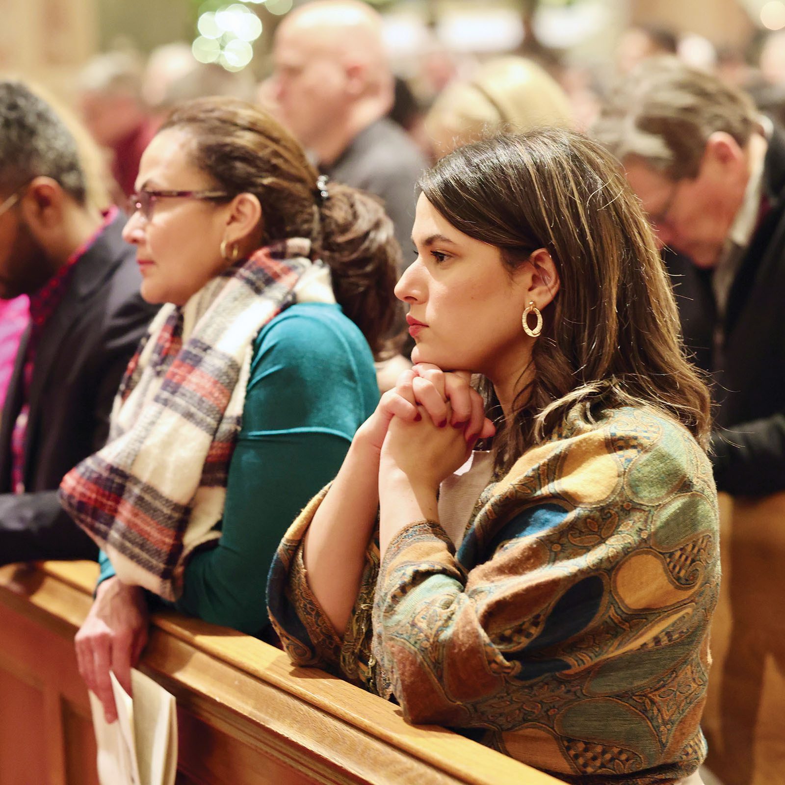 People pray during a Mass of the Nativity of the Lord on Christmas Eve, Dec. 24, 2024, at the Cathedral of St. Matthew the Apostle in Washington, D.C. (Catholic Standard photo by Andrew Biraj)