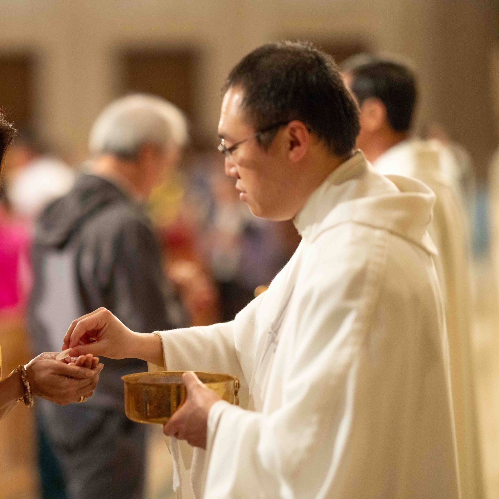 People receive Communion at a Mass during the 21st annual Asian and Pacific Island Catholics Marian Pilgrimage to the Basilica of the National Shrine of the Immaculate Conception on May 4, 2024. (Photos by Andrew Biraj)