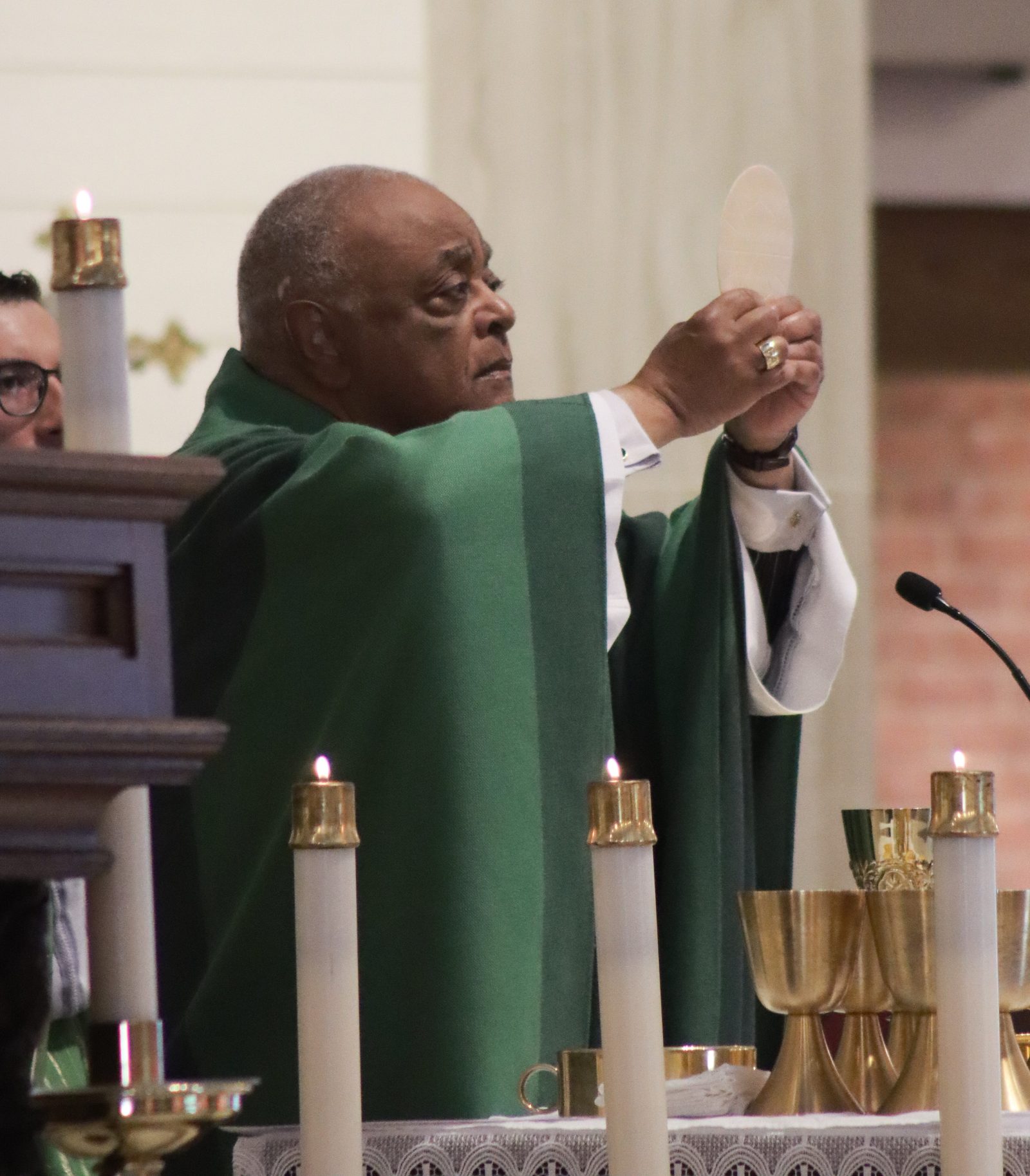 Washington Cardinal Wilton Gregory elevates the Eucharist during an Aug. 18 Mass that he celebrated at the Shrine of St. Jude in Rockville, Maryland. (Catholic Standard photo by Javier Diaz)