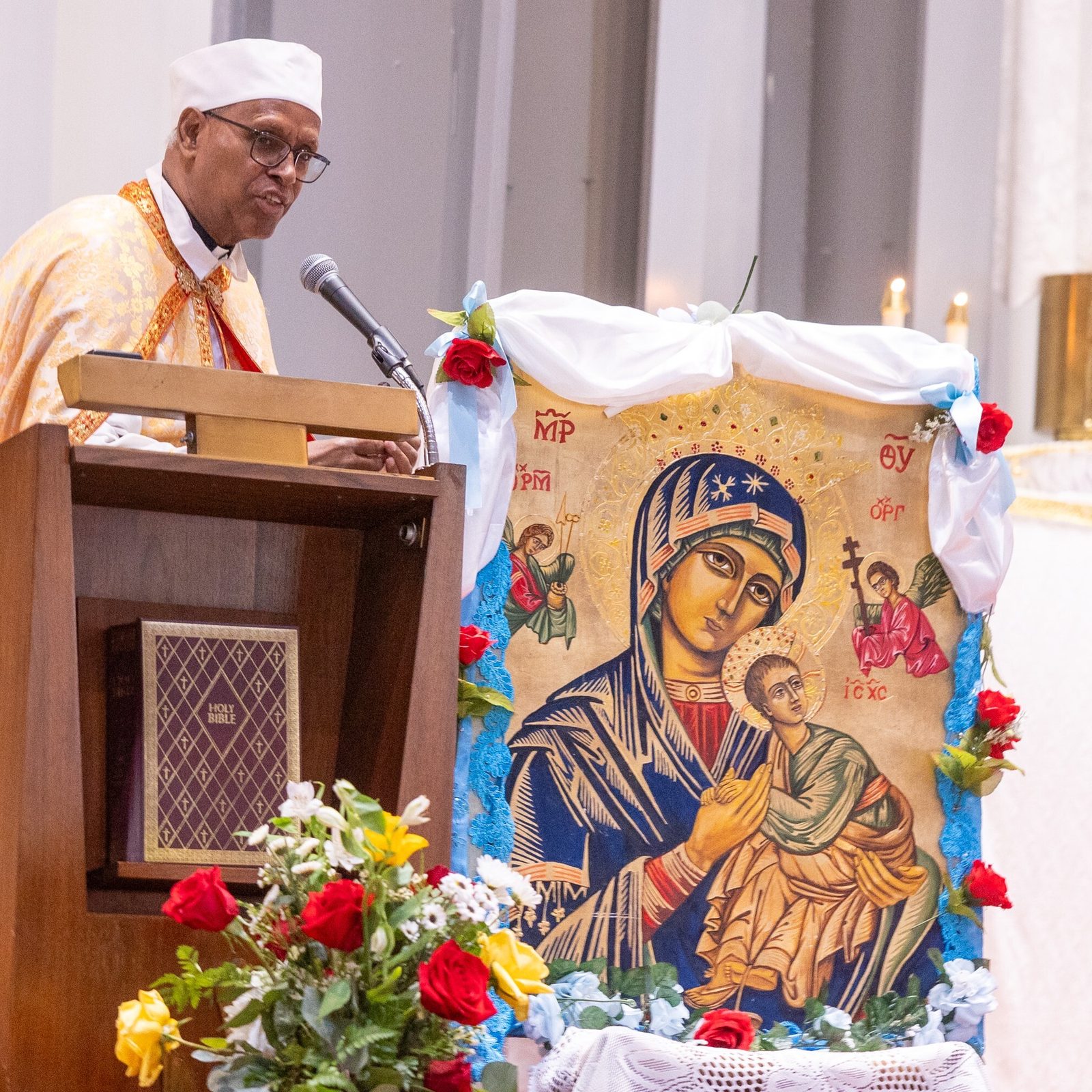 Father Tesfamariam Baraki, who earlier served as the founding pastor of Kidane-Mehret Parish for Ethiopian Catholics in the Archdiocese of Washington, speaks at a Mass on Aug. 24, 2025 at Holy Spirit Church in Forestville, Maryland that marked the feast day of the Assumption of the Blessed Virgin Mary and also marked Holy Spirit Church being the new home for that community. Father Baraki now serves as a chaplain at Howard University Hospital in Washington. (Catholic Standard photo by Mihoko Owada)
