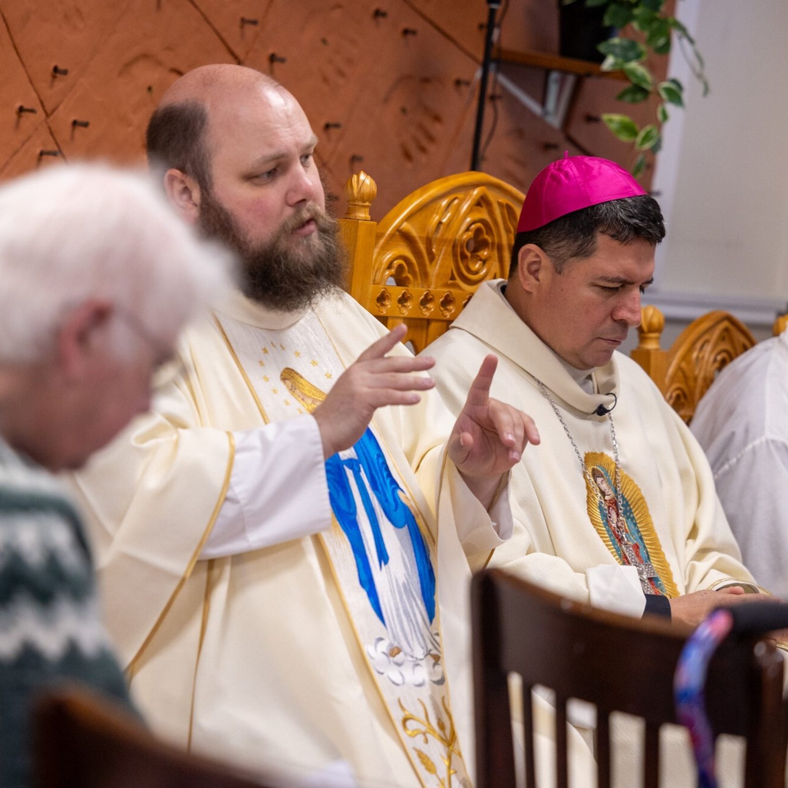 Father Patrick Mullan, the chaplain for the Office of Deaf and Disabilities Ministry of The Roman Catholic Archdiocese of Washington, uses American Sign Language to communicate the prayers during a May 11 Mass hosted by that office at the Pope Francis Center in Landover Hills for people living with mental health challenges. Father Mullan also serves as the Catholic chaplain at Gallaudet University and at the St. Francis Deaf Catholic Church in Landover Hills. (Catholic Standard photo by Mihoko Owada)