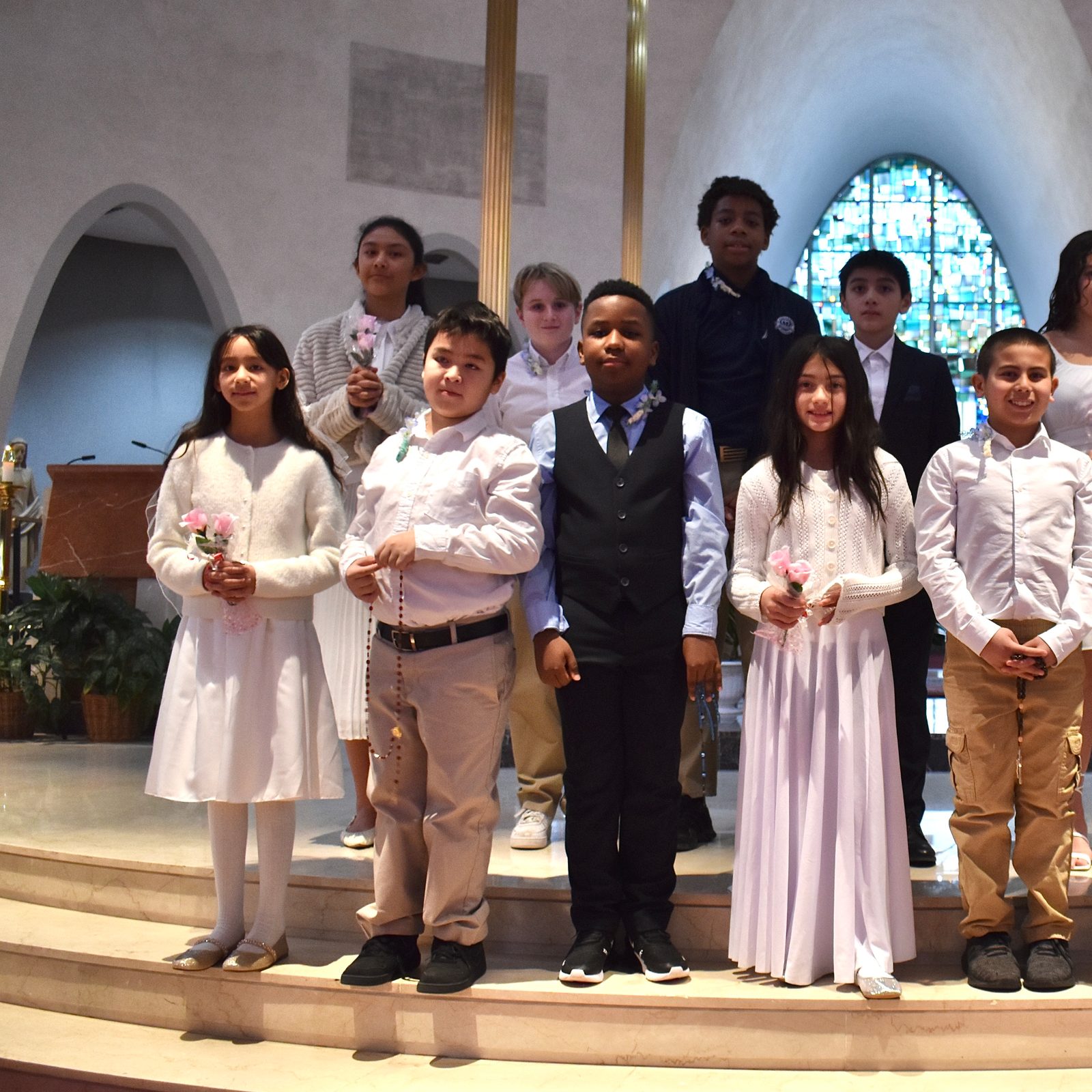 The 12 students from St. Mary’s School in Rockville, Maryland, who received their First Holy Communion during a Mass at St. Mary’s Church on Jan. 31, 2025 included, from left to right in the front row: Sophie Durandal, a fifth grader; Christopher Tran, a fifth grader; Ariel Varela, an eighth grader; Isabelle Salvado, a fourth grader; Brayden Robinson, a sixth grader; Nolan Alexander, a fifth grader; and Mariangel Figueroa Parra, a fourth grader. In the back row from left to right are Chelsea Hermenegildo, a seventh grader; Blake Anthony, an eighth grader; Frank Tanyi Oben, an eighth grader; Mason Salvado, a sixth grader; and Alyssa Robinson, a seventh grader. (Photo by Anna Quattrone, Catholic Schools Office of The Roman Catholic Archdiocese of Washington)