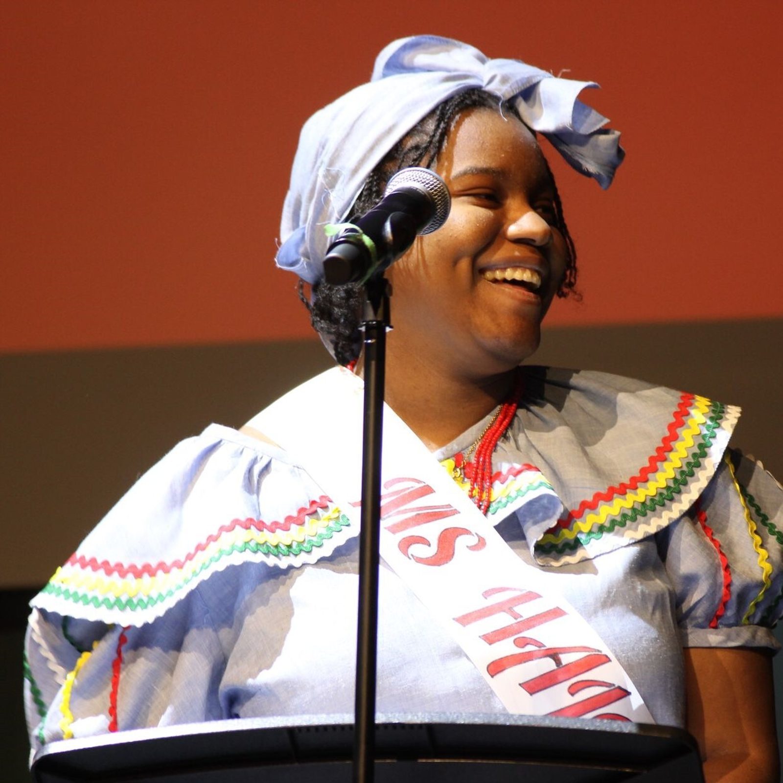 Anne-Sophie Gray, a member of the class of 2024 at Georgetown Visitation Preparatory School in Washington, D.C., participates in the Black Women’s Society Assembly at her school. Gray, whose family is Haitian, wore a Karabela dress that her grandmother made for her. (Photo courtesy of Georgetown Visitation Preparatory School)