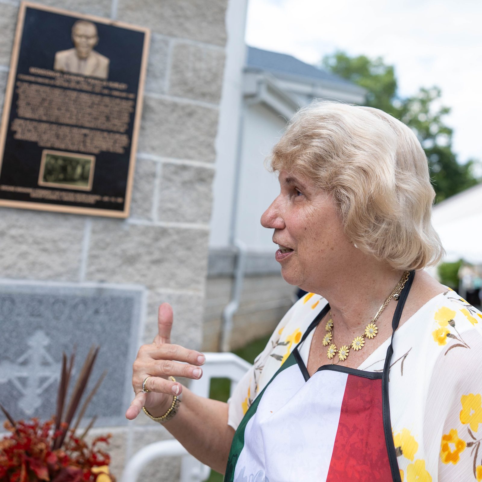 Joan Gerard, who has been a member of Mother Seton Parish in Germantown, Maryland, for 48 years, stands near a plaque outside the church that honors Msgr. Leonard Hurley, the parish’s founding pastor who served there from 1974 to 1987. As Mother Seton’s pastor, Msgr. Hurley led the parish in its early years and also hosted community and civic activities. Father Hurley Boulevard in Germantown was dedicated in his honor in 1988. (Top photo by Mihoko Owada, bottom photo by Mark Zimmermann)