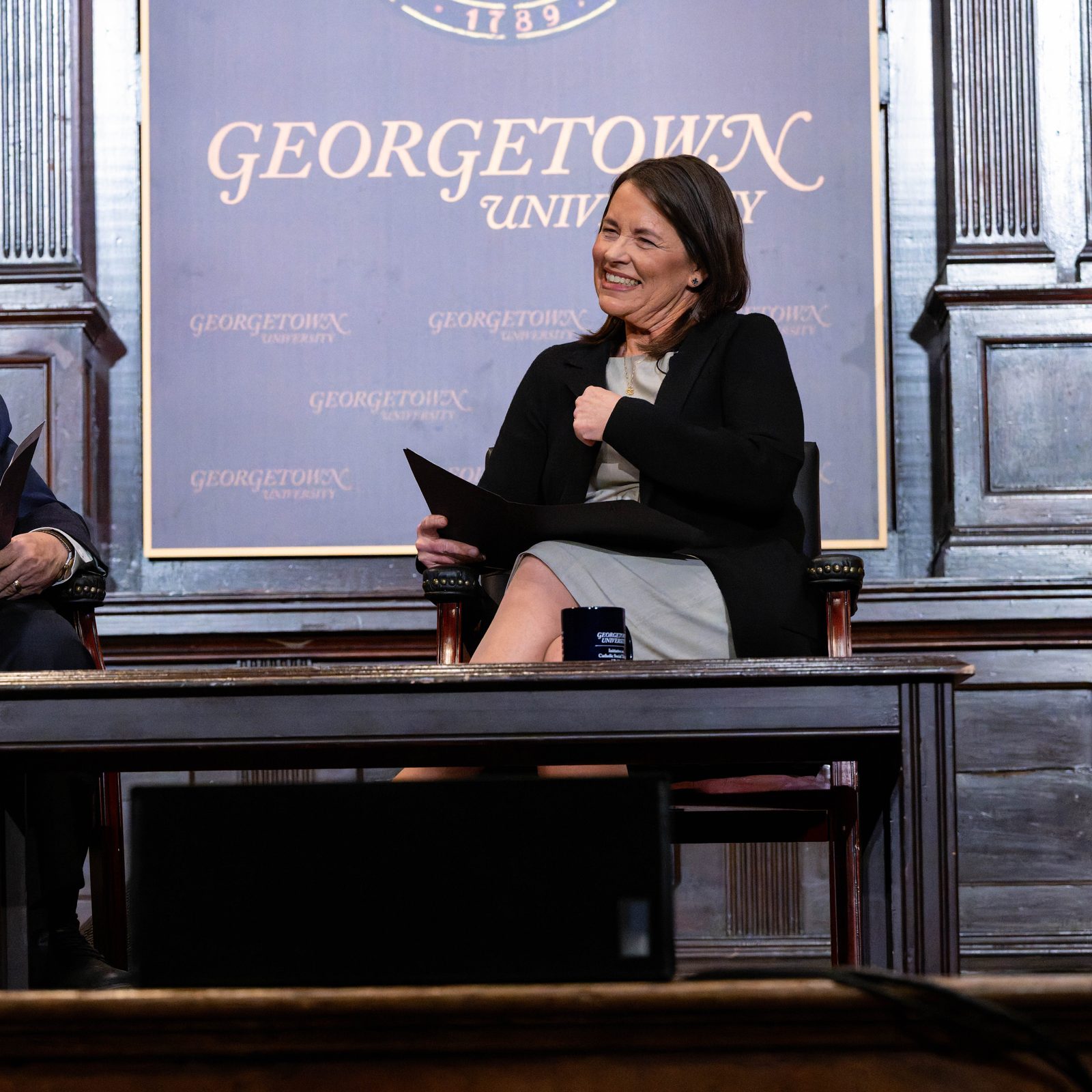 At left, John Carr, the founder of the Initiative on Catholic Social Thought and Public Life at Georgetown University, is joined in a conversation on Jan. 21, 2026 with Kim Daniels, the initiative’s director who succeeded him in that role. Carr, who is now 75, retired a the end of 2025. The gathering that evening at Georgetown was titled, “50 Years Connecting Catholic Social Thought and Public Life: Lessons from John Carr’s Leadership.” (Georgetown University photo/Phil Humnicky)