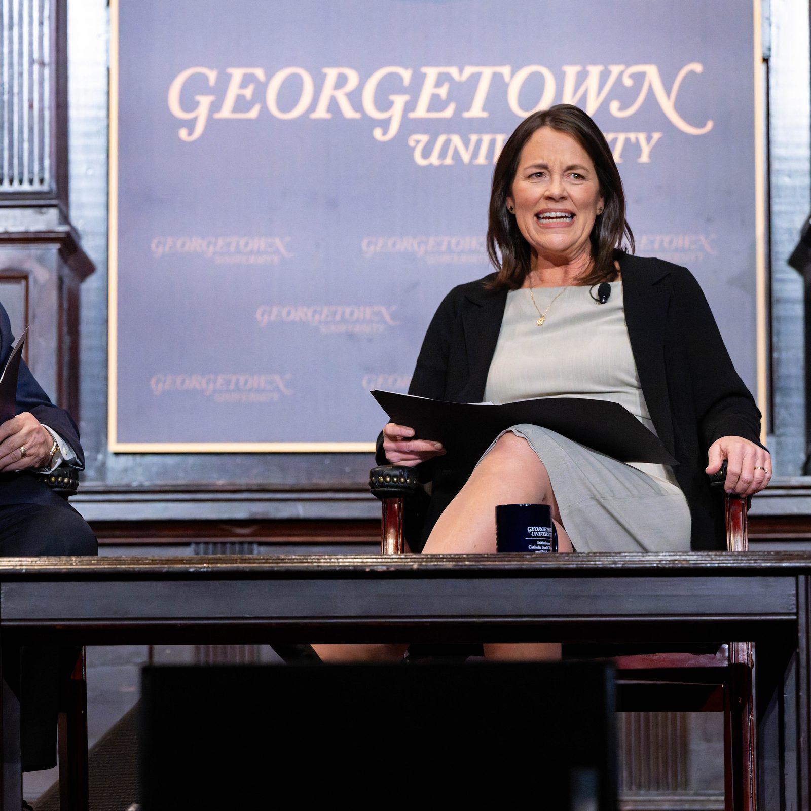 At left, John Carr, the founder of the Initiative on Catholic Social Thought and Public Life at Georgetown University, is joined in a conversation on Jan. 21, 2026 with Kim Daniels, the initiative’s director who succeeded him in that role. Carr, who is now 75, retired at the end of 2025. The gathering that evening at Georgetown was titled, “50 Years Connecting Catholic Social Thought and Public Life: Lessons from John Carr’s Leadership.” (Georgetown University photo/Phil Humnicky)