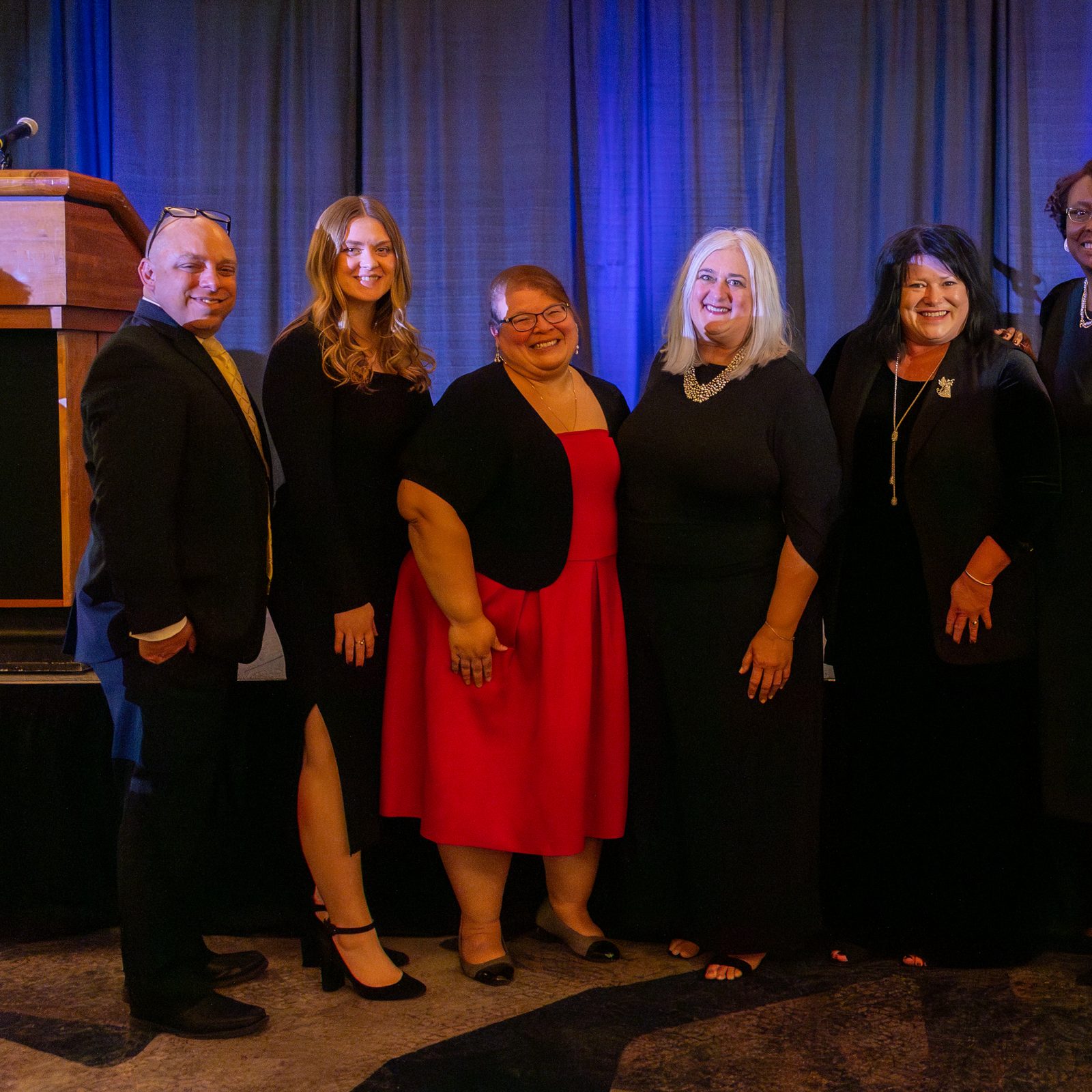 Kelly Branaman (fourth from left), the Secretary for Catholic Schools and Superintendent of Schools for The Roman Catholic Archdiocese of Washington, received the Community Leader of the Year Award at the Catholic Business Network of Montgomery County Gala on Nov. 22, 2024. Some of her colleagues from the archdiocese’s Catholic Schools Office joined her for a photo afterward. From left to right are Jeremy McDonald, the Assistant Superintendent for Research, Planning and Administrative Technologies; Anna Quattrone, the Director of Marketing and Enrollment; Christina Mendez-Hall, the Assistant Superintendent for Catholic Identity and Accreditation; Kelly Branaman; Denise Ball, the Assistant Superintendent for Teaching and Learning; Roshon Casey, the Director of Early Childhood Programs; Jennifer Monger, the Director of Curriculum and Instruction; and Alicia Tierney, the Director of Counseling Services. (Catholic Standard photo by Mihoko Owada)