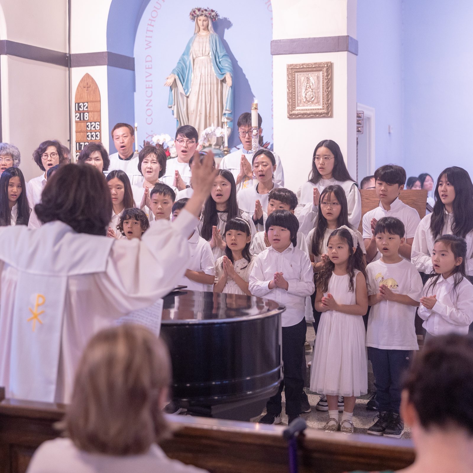 A Korean choir of adults, youth and children sings the “Ave Maria” during a Mass on May 18, 2025 at Epiphany Catholic Church in Washington, D.C., marking the parish’s 100th anniversary. The Mass included prayers, songs and readings in English and Korean. Each Sunday at 9 a.m., a Mass is celebrated in Korean at Epiphany Catholic Church for the Korean community there. (Catholic Standard photo by Mihoko Owada)