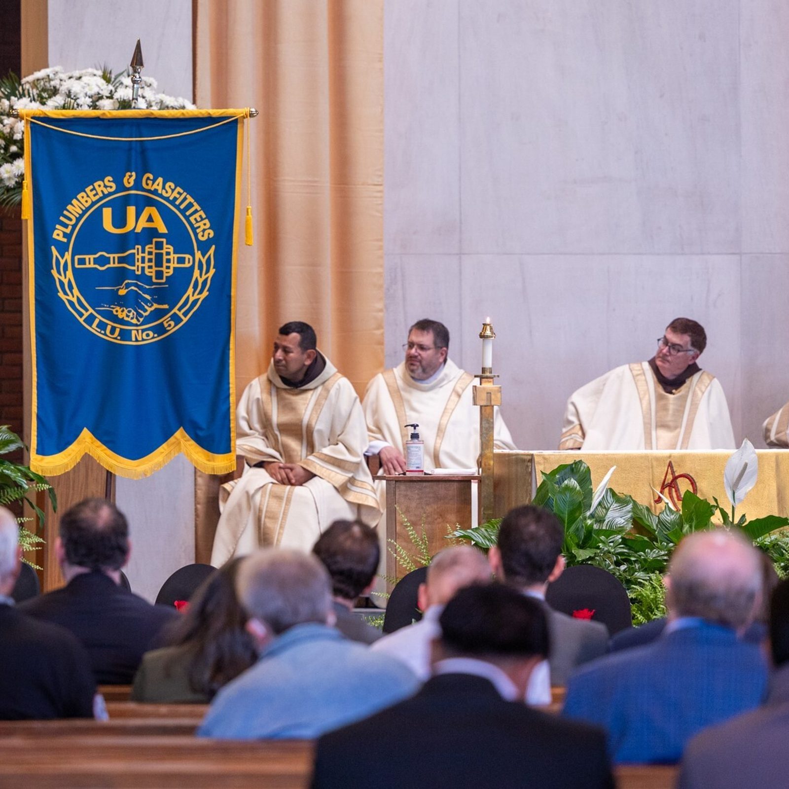 At left, Portia Wu, the Secretary of Labor for the State of Maryland, speaks at the Building Trades’ Workers Memorial Mass on April 25 at St. Camillus Church in Silver Spring, Maryland. The Mass was held in conjunction with Workers Memorial Day that is marked around the world on April 28. (Catholic Standard photo by Mihoko Owada)