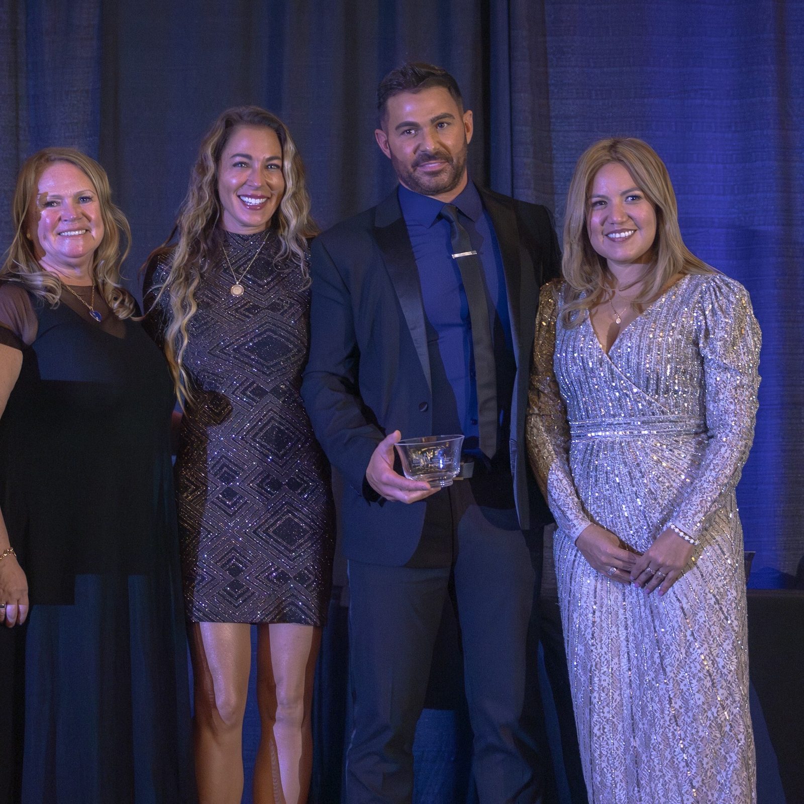 At its Nov. 22 Gala, the Catholic Business Network of Montgomery County presented its Catholic School Business Partner of the Year Award to the Gringos & Mariachis Mexican restaurant and to the Miranian family for their support of Mary of Nazareth Catholic School in Darnestown, Maryland. From left to right are Jeanne Donatelli, the principal of St. Jude Regional Catholic School in Rockville who announced the award; Susan Apgood, the emcee for the gala; Cheryl and Marc Miranian who received the Catholic School Business Partner of the Year Award; and Greta Vento, the president of CBN-MC. (Catholic Standard photo by Mihoko Owada)