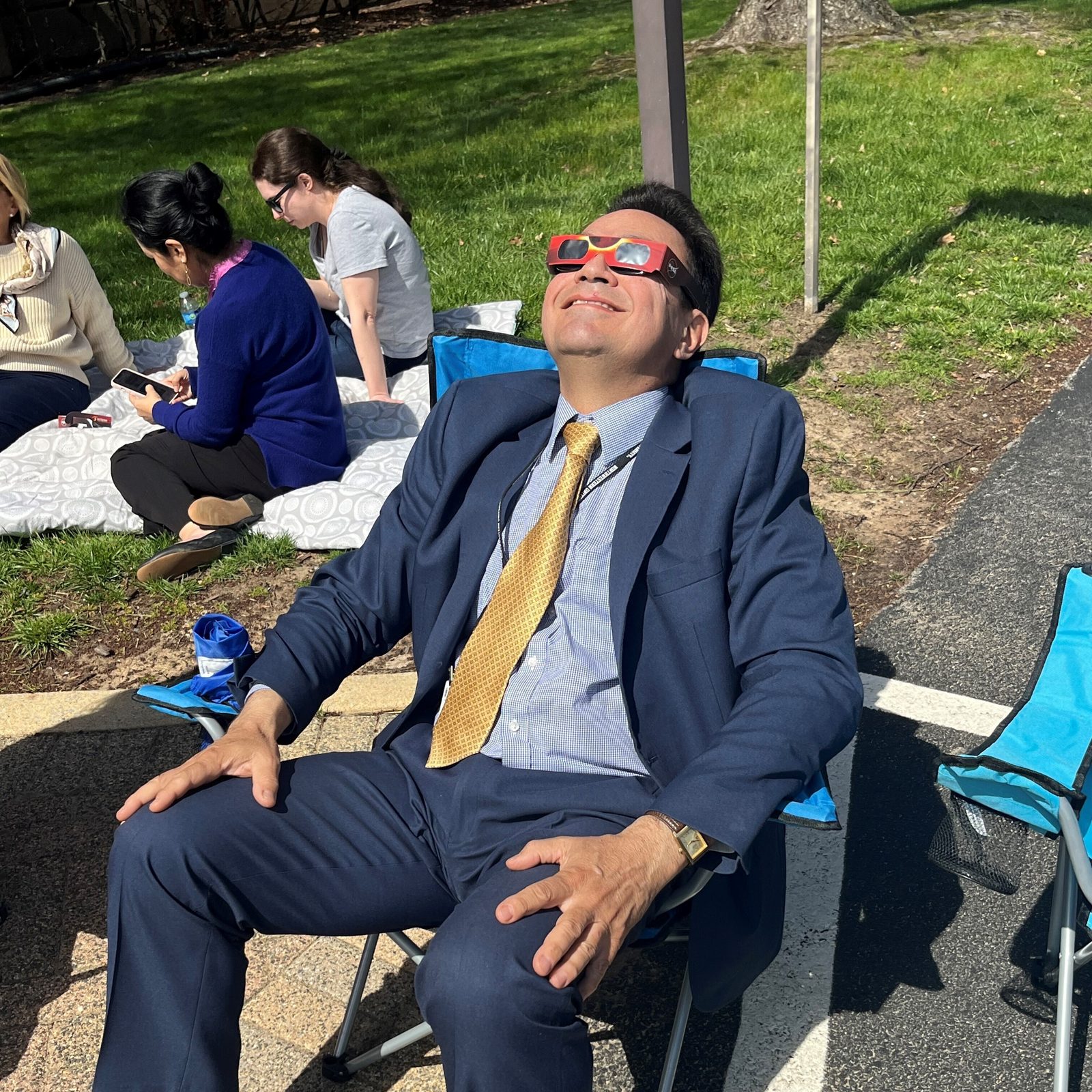 Miguel Guilarte of the Secretariat of Communications for The Roman Catholic Archdiocese of Washington watches the solar eclipse on April 8, 2024 outside the Archdiocesan Pastoral Center in Hyattsville, Maryland. (Catholic Standard photo by Mark Zimmermann)