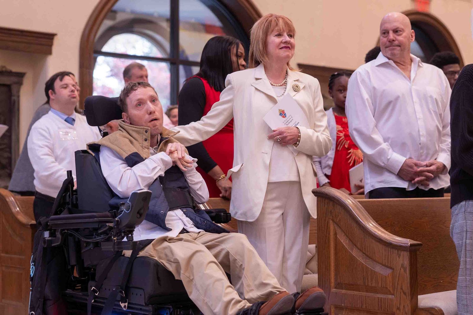 Michael Quinn at left is joined by his mother Ann Quinn at the White Mass on Oct. 26 at Our Lady of Mercy Church in Potomac. (Catholic Standard photo by Mihoko Owada)