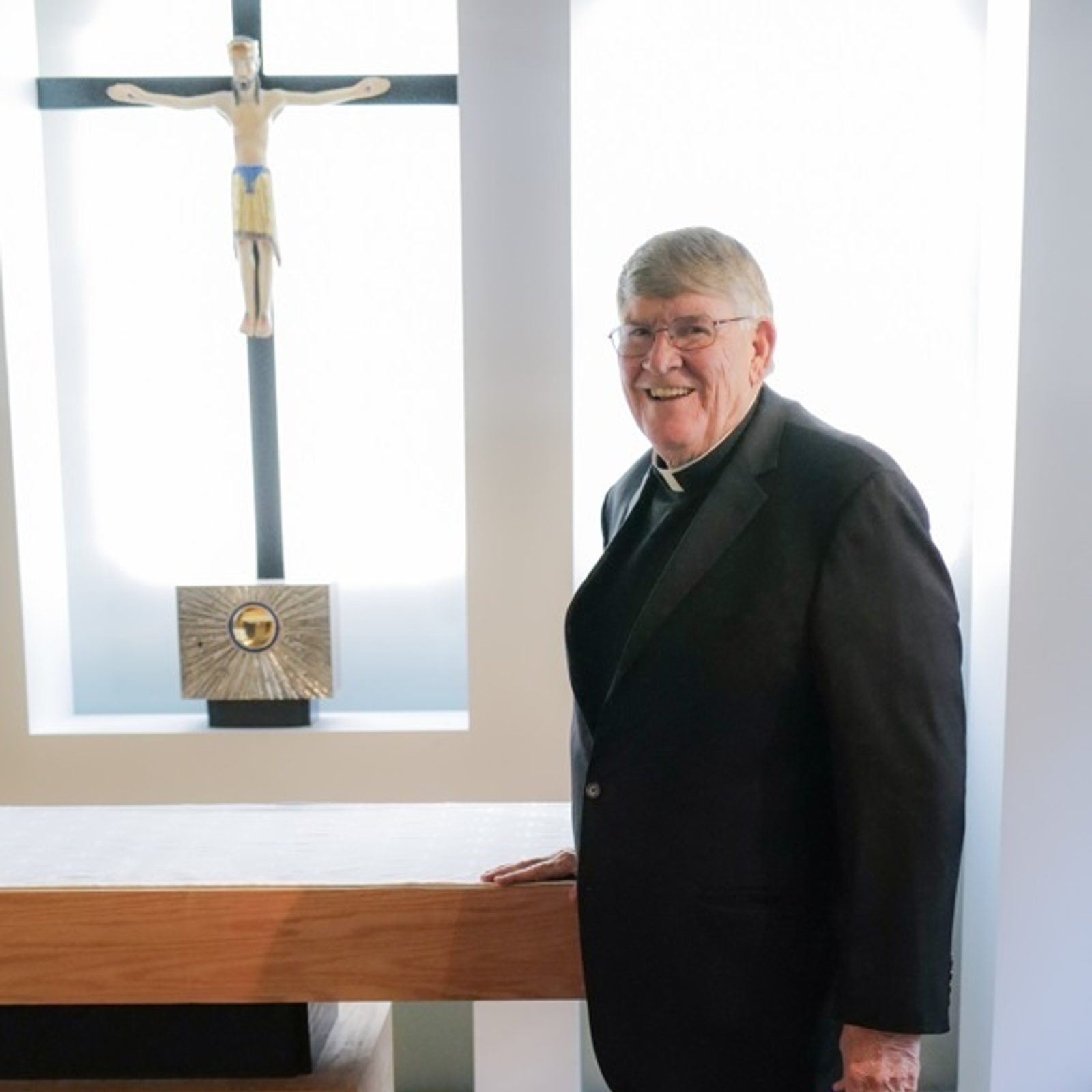 Msgr. John Enzler, the mission advocate of Catholic Charities of The Roman Catholic Archdiocese of Washington, stands in the chapel at the agency’s headquarters in downtown Washington, D.C. Msgr. Enzler formerly served as the president and CEO of the agency. (Photo courtesy of Catholic Charities)