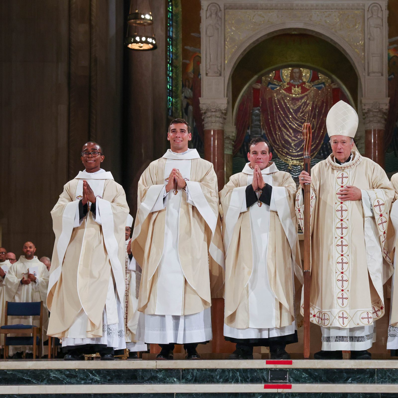 After the June 21, 2025 Mass of Priesthood Ordination at the Basilica of the National Shrine of the Immaculate Conception where he ordained five new priests for the Roman Catholic Archdiocese of Washington, Cardinal Robert W. McElroy at center stands with the new priests. From left to right are Father Chukwuma Odigwe, Father Daniel Morrison, Father Louis McHale, Cardinal McElroy, Father Gerard Gayou and Father Marco Cerritelli. (Catholic Standard photo by Andrew Biraj)