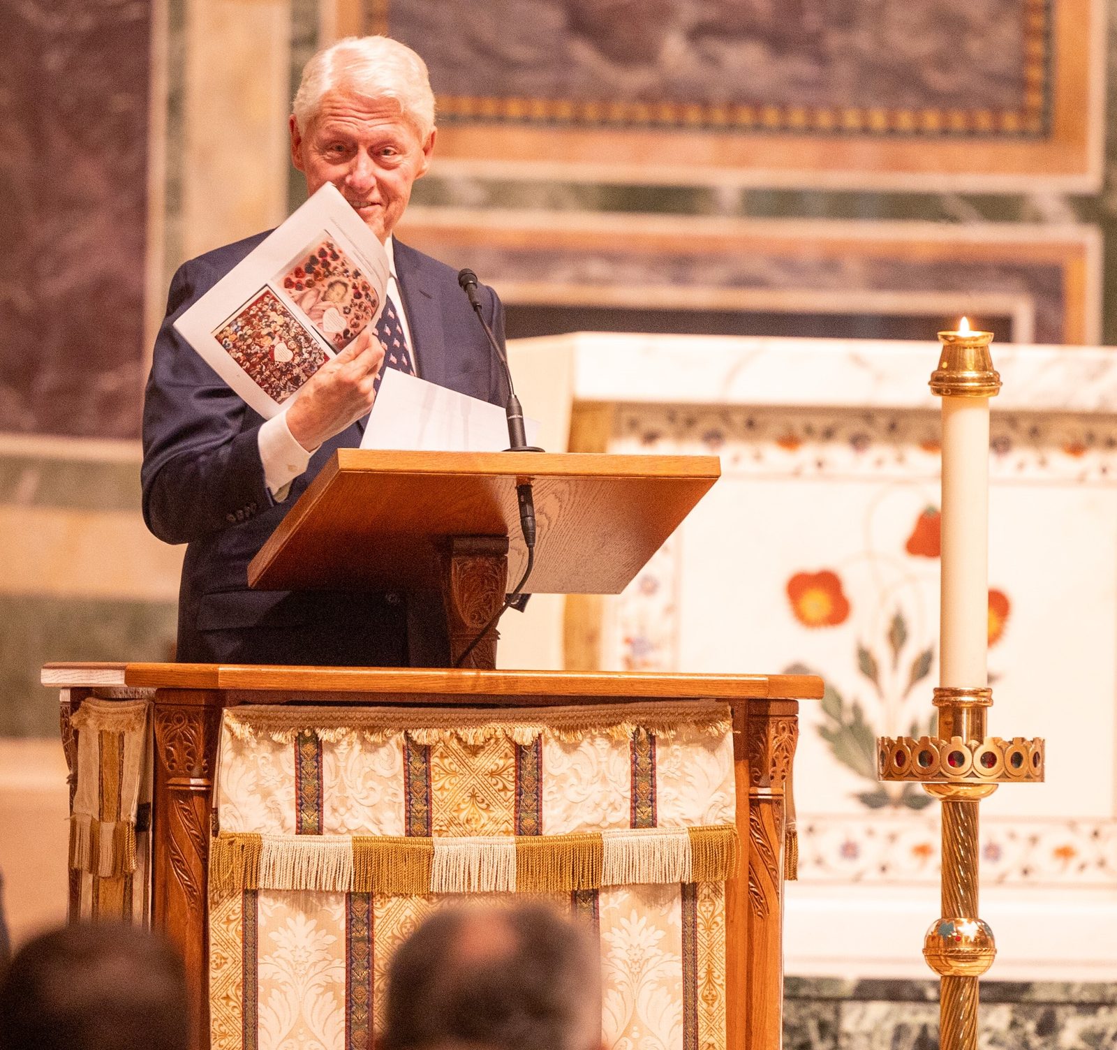 During an Oct. 16 celebration of the life of the late Ethel Kennedy held at St. Matthew’s Cathedral in Washington, former President Bill Clinton holds a copy of a valentine that she once sent him. (Catholic Standard photo by Mihoko Owada)