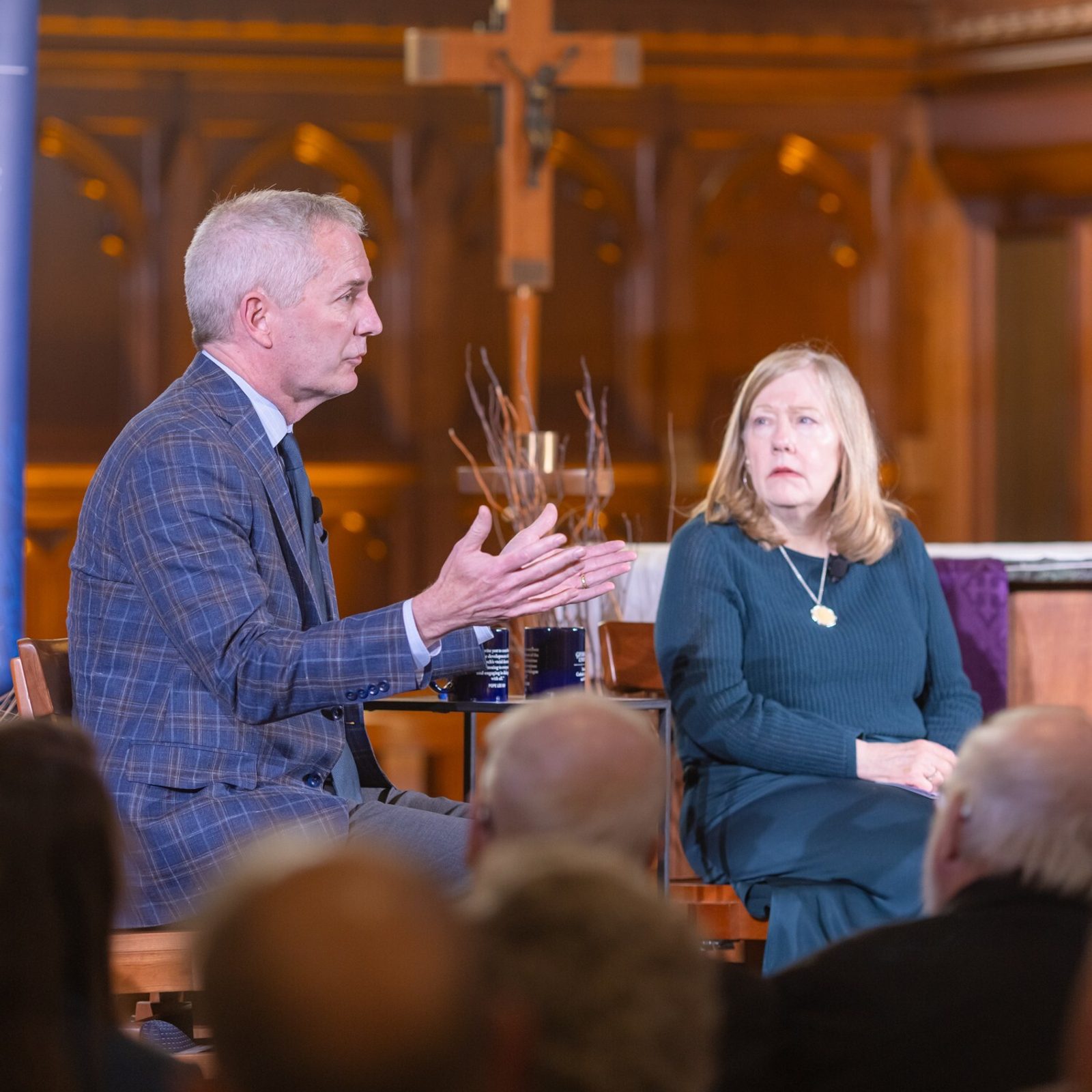 Robert K. Vischer (at left), the president of the University of St. Thomas in St. Paul, Minnesota, speaks during a discussion on “Faith, Democracy, and the Common Good: Lessons from John Courtney Murray for Our Times,” held March 18, 2026 at the Dahlgren Chapel of the Sacred Heart at Georgetown University in Washington, D.C. At right is Cathleen Kaveny, a professor in Boston College’s Law School and Department of Theology who also spoke at the Dahlgren Dialogue, which was sponsored by university’s Office of Mission & Ministry and by the Initiative on Catholic Social Thought and Public Life at Georgetown. (Catholic Standard photo by Rachel Lincoln)