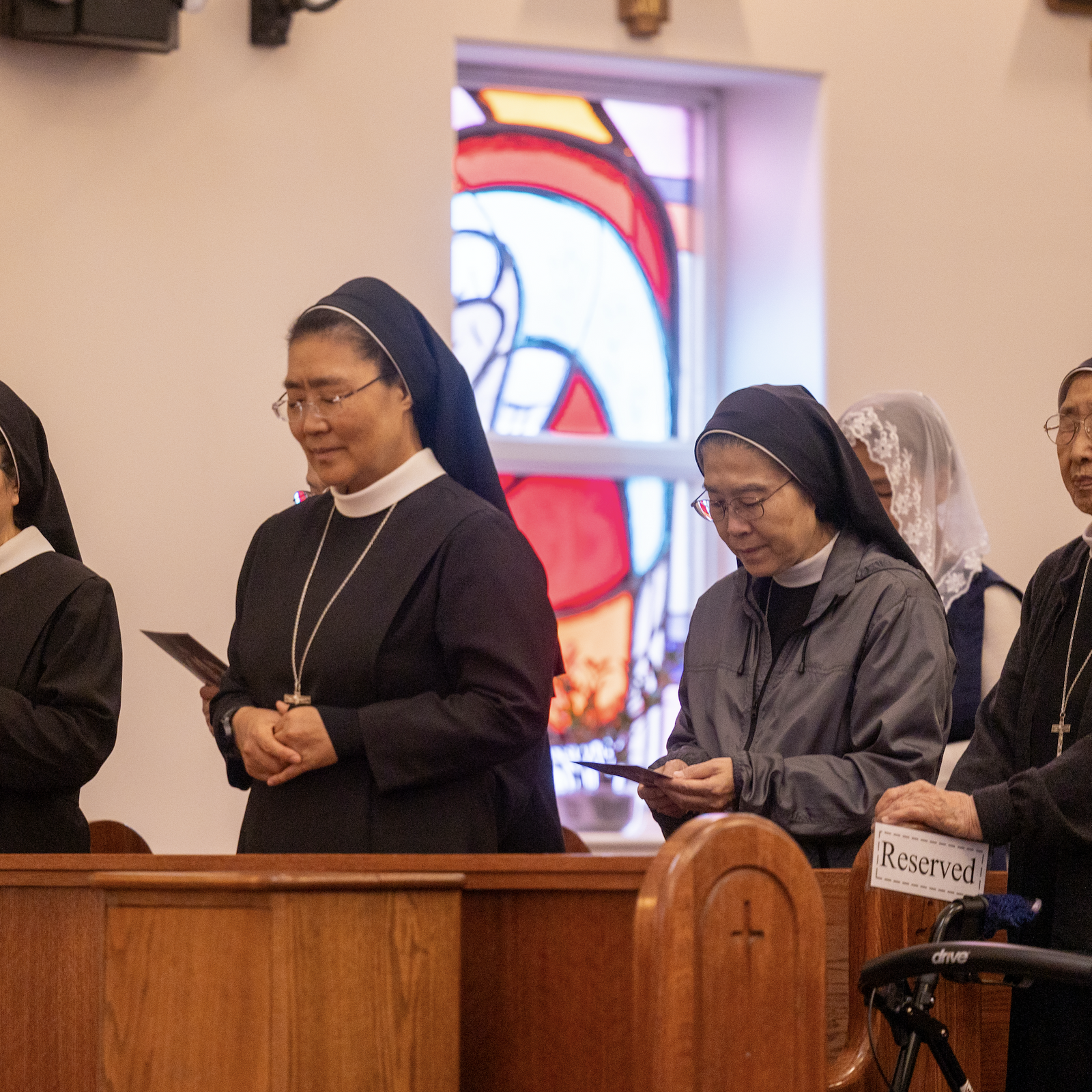 Members of the Little Sisters of the Holy Family pray during a Sept. 29 Mass marking the 50th anniversary of St. Andrew Kim Parish in Olney, Maryland. The religious order with members from Korea serves the Korean community in this area. (Catholic Standard photo by Mihoko Owada)