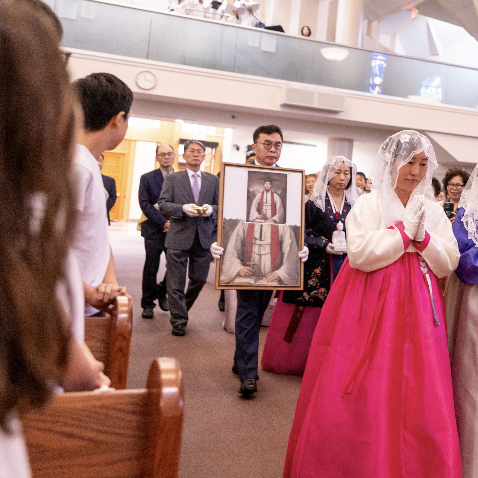 During a Mass on Sept. 29, 2024 marking the 50th anniversary of St. Andrew Kim Parish in Olney, parishioners bring offertory gifts to the altar, including a sculpture and puzzle portrait of St. Andrew Kim, the parish’s patron saint. (Catholic Standard photo by Mihoko Owada)