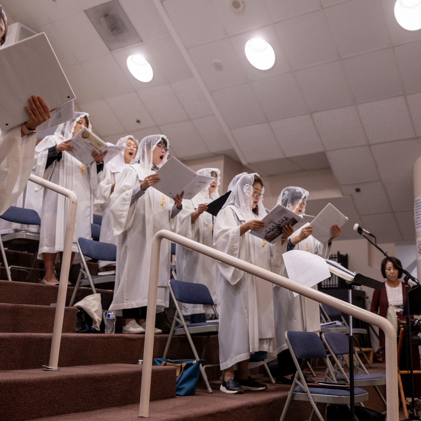 Choir members sing during a Mass on Sept. 29, 2024 marking the 50th anniversary of St. Andrew Kim Parish in Olney, Maryland, that serves Korean Catholics. (Catholic Standard photos by Mihoko Owada)