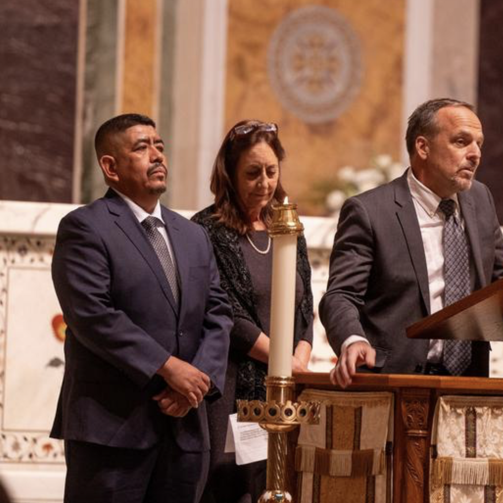 Lucas Benitez at left and Greg Asbed at right, co-founders of the Coalition of Immokalee Workers that promotes the human rights of farmworkers, were among the speakers at an Oct. 16 celebration of the life of the late Ethel Kennedy held at the Cathedral of St. Matthew the Apostle in Washington, D.C. (Catholic Standard photo by Mihoko Owada)