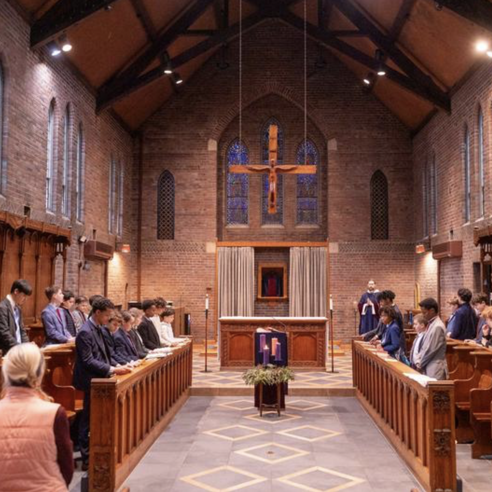 Benedictine Father Samuel Springuel celebrates a Mass at the chapel at St. Anselm's Abbey on Dec. 11, 2024, as seventh grade students from St. Anselm's Abbey School attend the Mass. (Catholic Standard photo by Mihoko Owada)