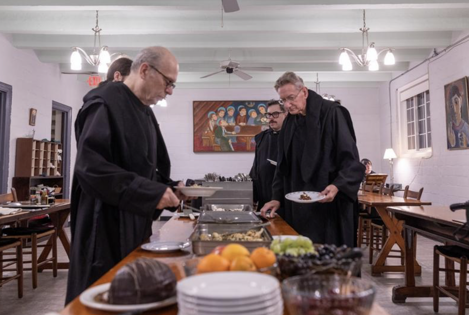 During a silent dinner on Dec. 11, 2024 at St. Anselm's Abbey in Washington, the Benedictine monks get food in the refectory there. From left to right are Benedictine Brother Dunstan Robidoux, Benedictine Brother Cyprian Morales and Benedictine Father Peter Weigand (Catholic Standard photo by Mihoko Owada)