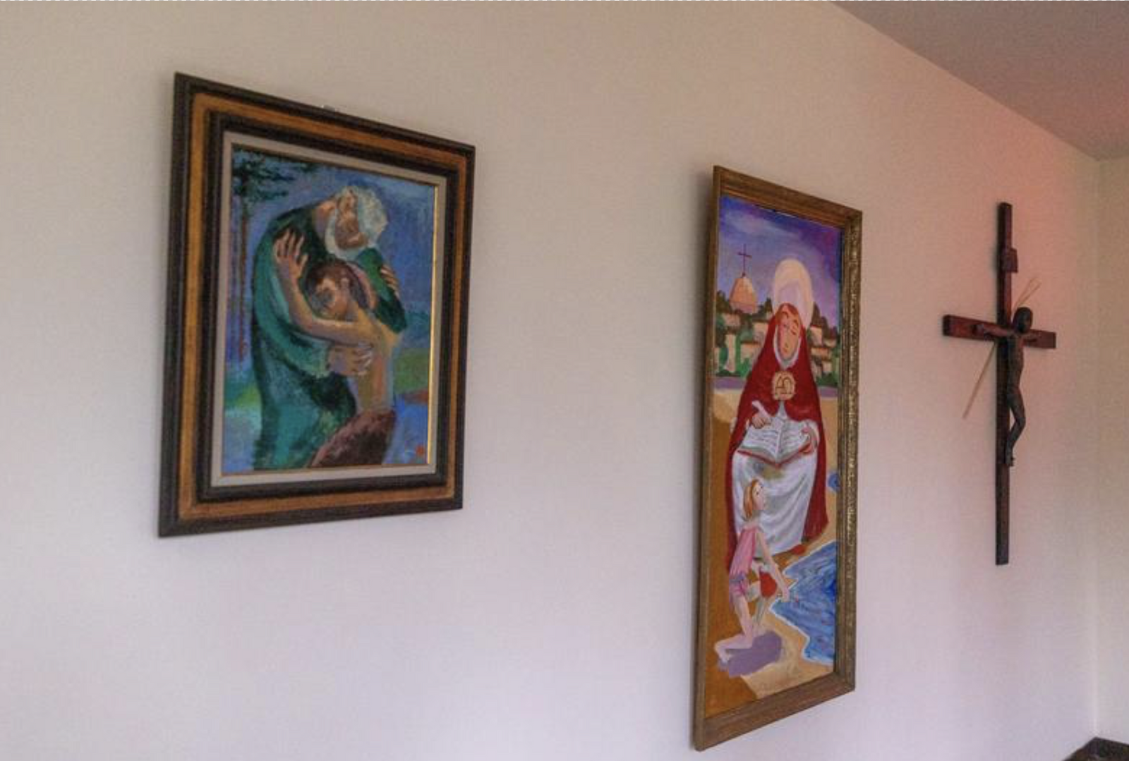 Artworks by Benedictine Father Stephen Reid (1912-1989) are displayed in the hallway of St. Anselm's Abbey in Washington. (Catholic Standard photo by Mihoko Owada)