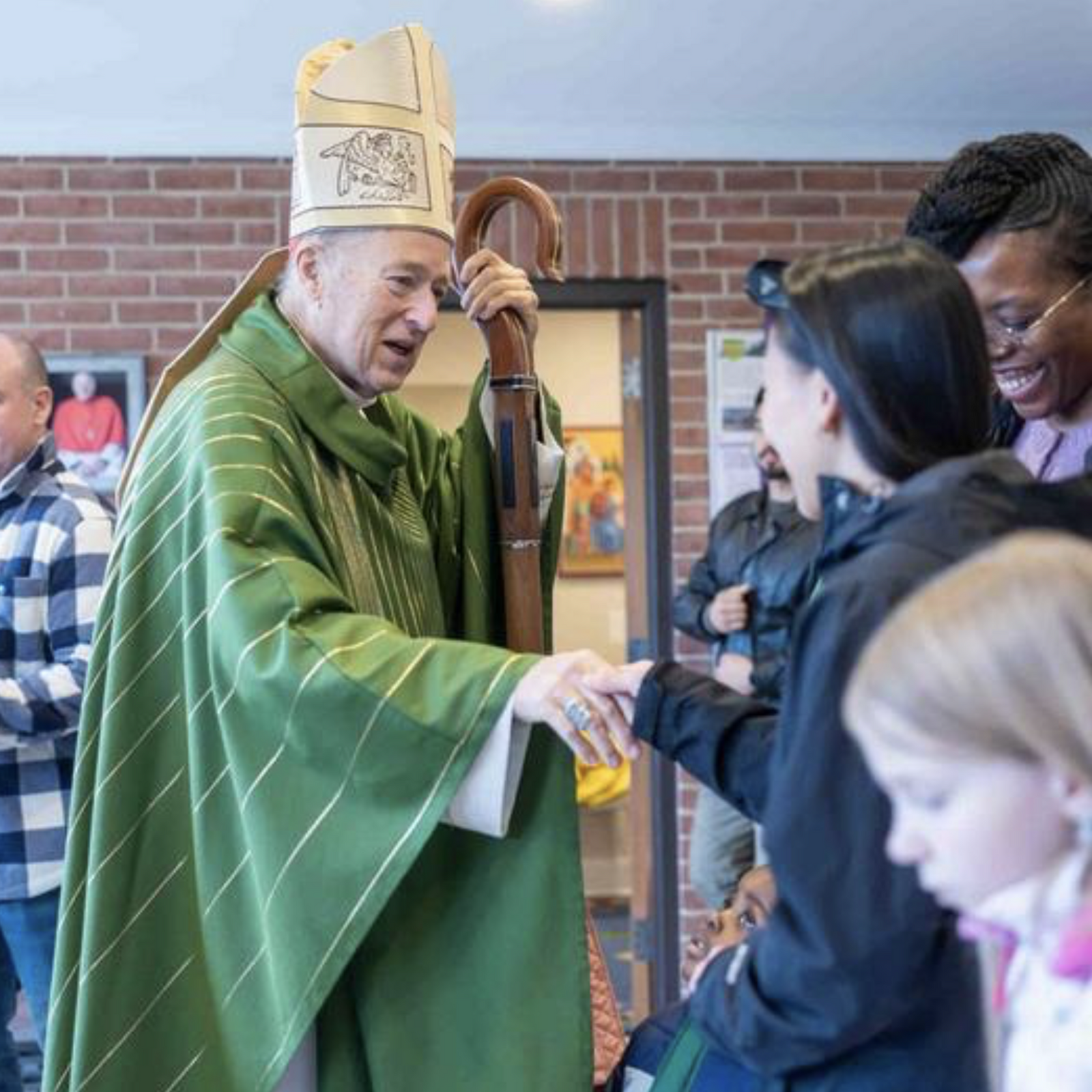 Washington Cardinal Robert W. McElroy greets people after celebrating a Jan. 18 Mass at Shrine of St. Jude Catholic Church in Rockville, Maryland that he offered in remembrance of the legacy of the Rev. Dr. Martin Luther King Jr. (Catholic Standard photo by Mihoko Owada)
