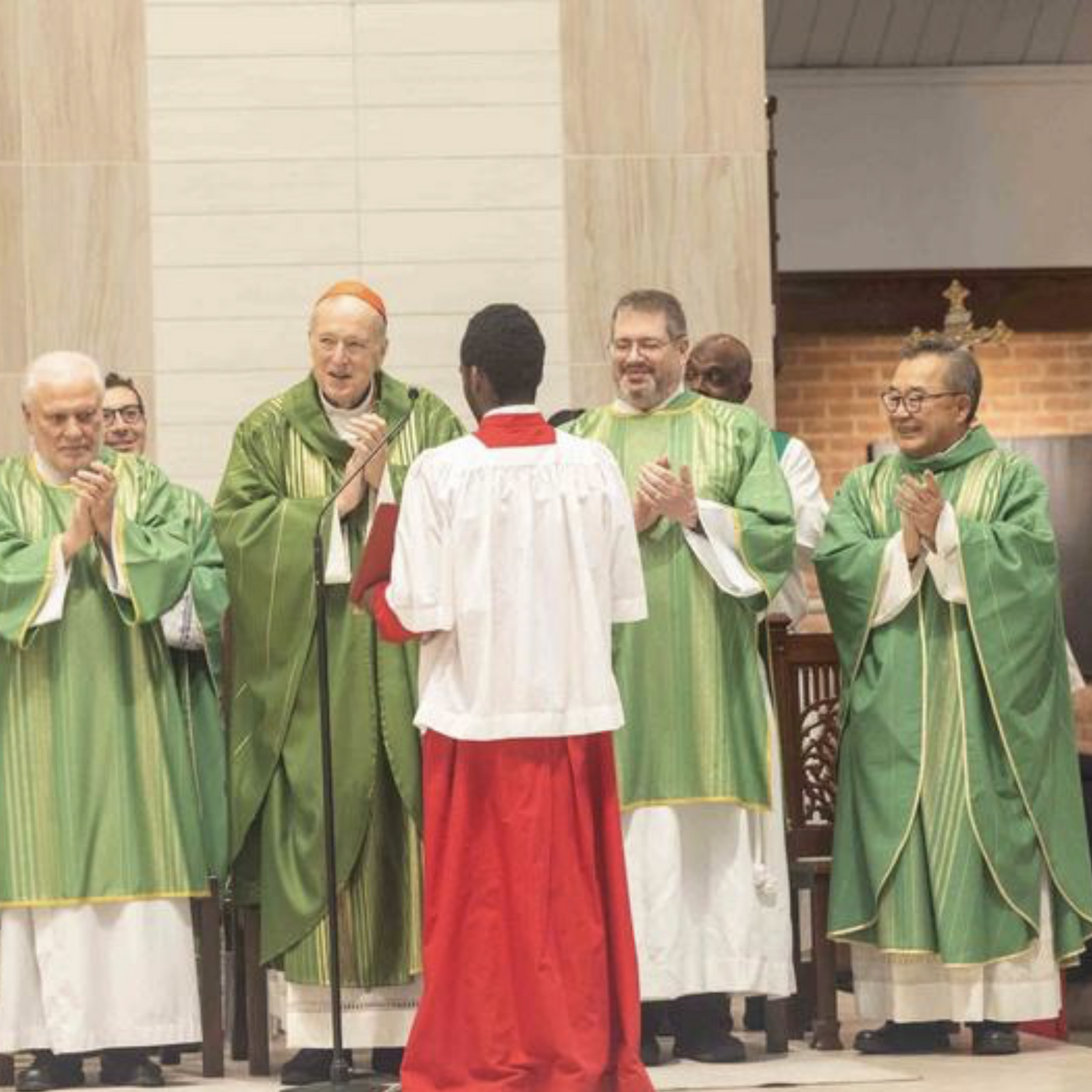 Washington Cardinal Robert W. McElroy extends his gratitude and applause to all those who prepared for and participated in the Mass commemorating the legacy of Rev. Martin Luther King Jr. at the end of the Mass celebrated at Shrine of St. Jude Catholic Church in Rockville, Maryland. (Catholic Standard photo by Mihoko Owada)