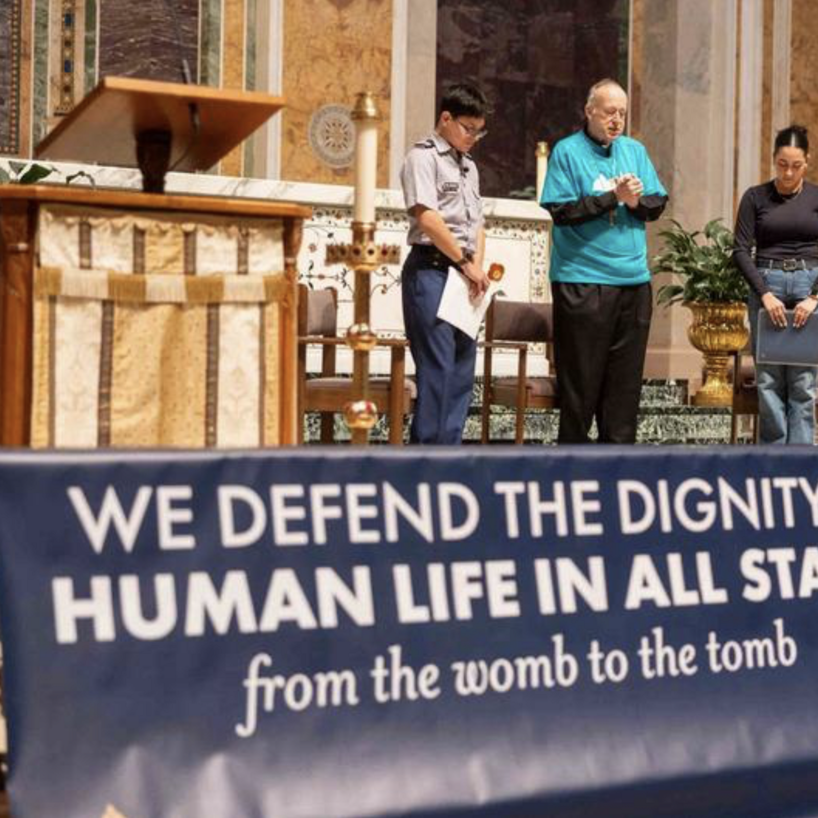 Cardinal Robert W. McElroy, the archbishop of Washington, prays with high school juniors Jorge Velasquez of St. John’s College High School in Washington, D.C., at left, and Andrea Patiño of the Academy of the Holy Cross in Kensington, Maryland, at right before a question-and-answer session that preceded the Youth Mass for Life on Jan. 23, 2026 at the Cathedral of St. Matthew the Apostle in Washington, D.C. The discussion followed testimonies from those two students who reflected on how they came to understand the dignity and value of human life. (Catholic Standard photo by Mihoko Owada)