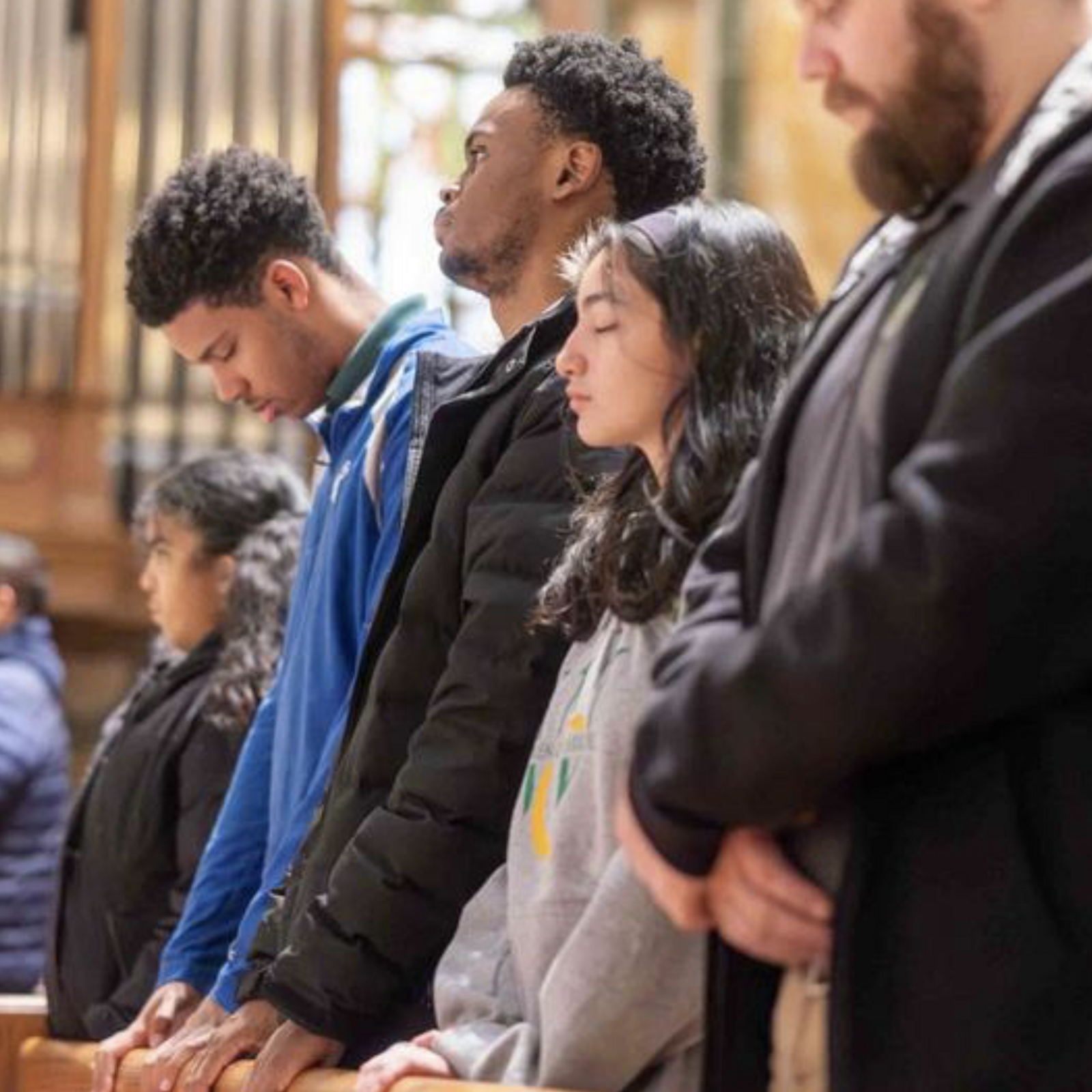 Young people pray together with Cardinal Robert W. McElroy, the archbishop of Washington at right before a question-and-answer session that preceded the Youth Mass for Life on Jan. 23, 2026 at the Cathedral of St. Matthew the Apostle in Washington, D.C. (Catholic Standard photo by Mihoko Owada)
