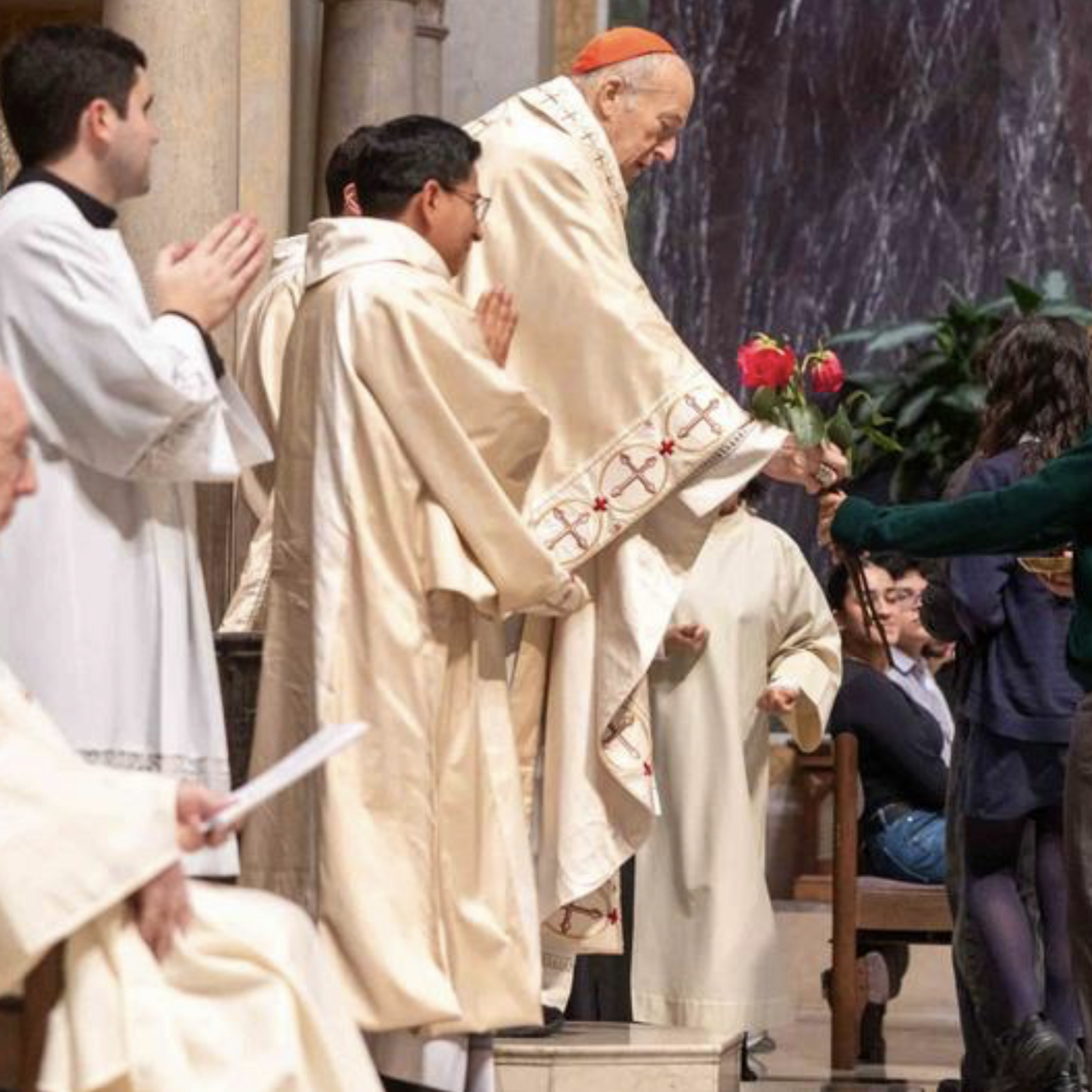 During the annual Youth Mass for Life on Jan. 23, 2026 at the Cathedral of St. Matthew the Apostle in Washington, a student presents an offertory gift of roses, a symbol of life, to Cardinal Robert W. McElroy, the main celebrant at the Mass. The Mass was held prior to the annual national March for Life. (Catholic Standard photo by Mihoko Owada)
