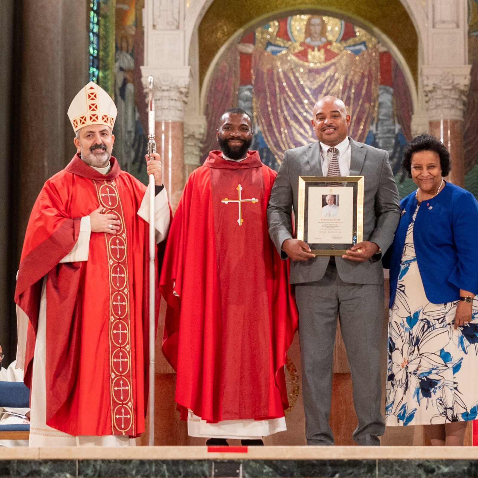 At the Opening of Schools Mass for the Roman Catholic Archdiocese of Washington on Aug. 25, 2025 at the Basilica of the National Shrine of the Immaculate Conception, the schools honored for milestone anniversaries included St. Francis Xavier Catholic Academy in Washington, D.C., which is marking its 85th anniversary this school year. From left to right are Washington Auxiliary Bishop Juan Esposito, the main celebrant at the Mass; Father Ebuka Mbanude, the administrator of St. Francis Xavier Parish; Harold Thomas, the principal of St. Francis Xavier Catholic Academy; Dr. Camille Privette, president of the archdiocese’s Consortium of Catholic Academies; and Kelly Branaman, the archdiocese’s Secretary for Catholic Schools and Superintendent of Schools. (Catholic Standard photo by Mihoko Owada)